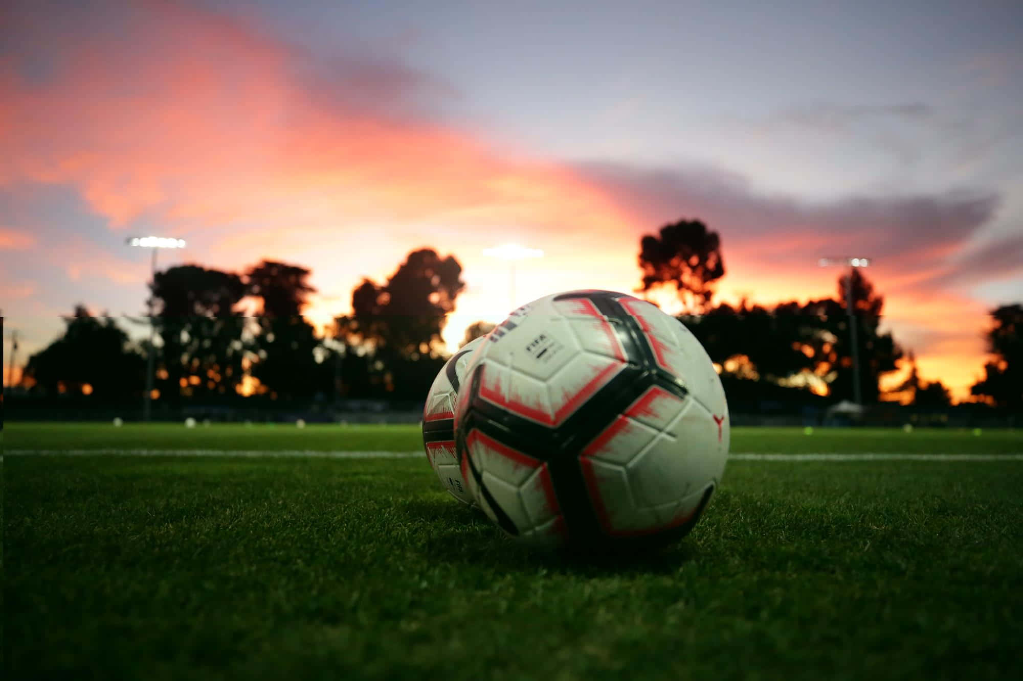 soccer ball, vibrant green turf, fiery sunset, Full HD Desktop Wallpaper