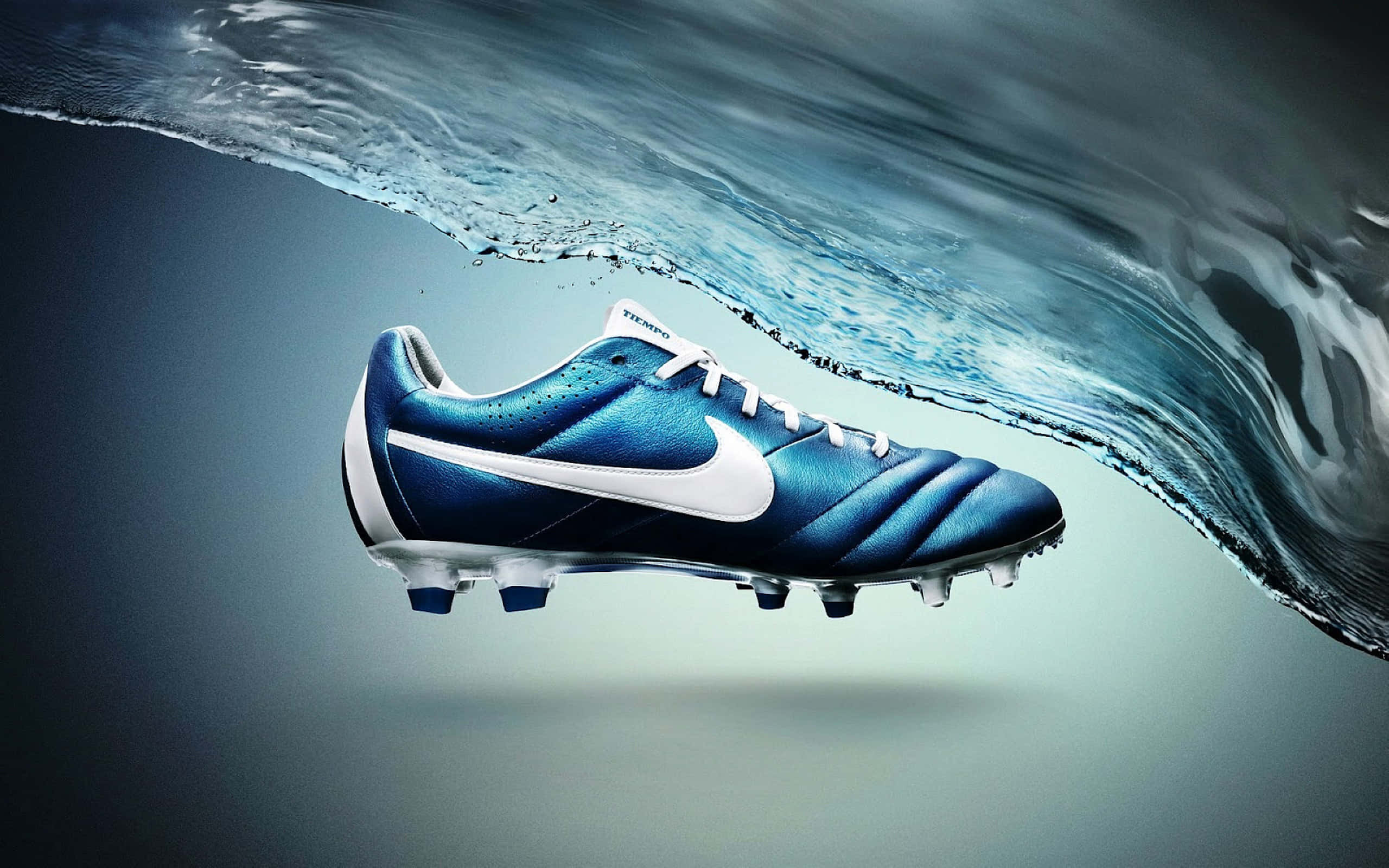 blue Nike football boot, white swoosh, dynamic wave of water, 2K Desktop Wallpaper