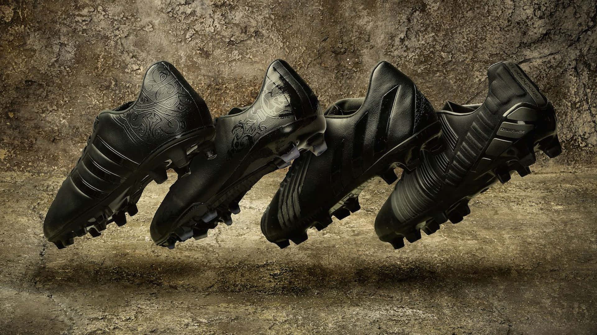 black soccer cleats, intricate silver patterns, gritty textured concrete wall, Full HD Desktop Wallpaper