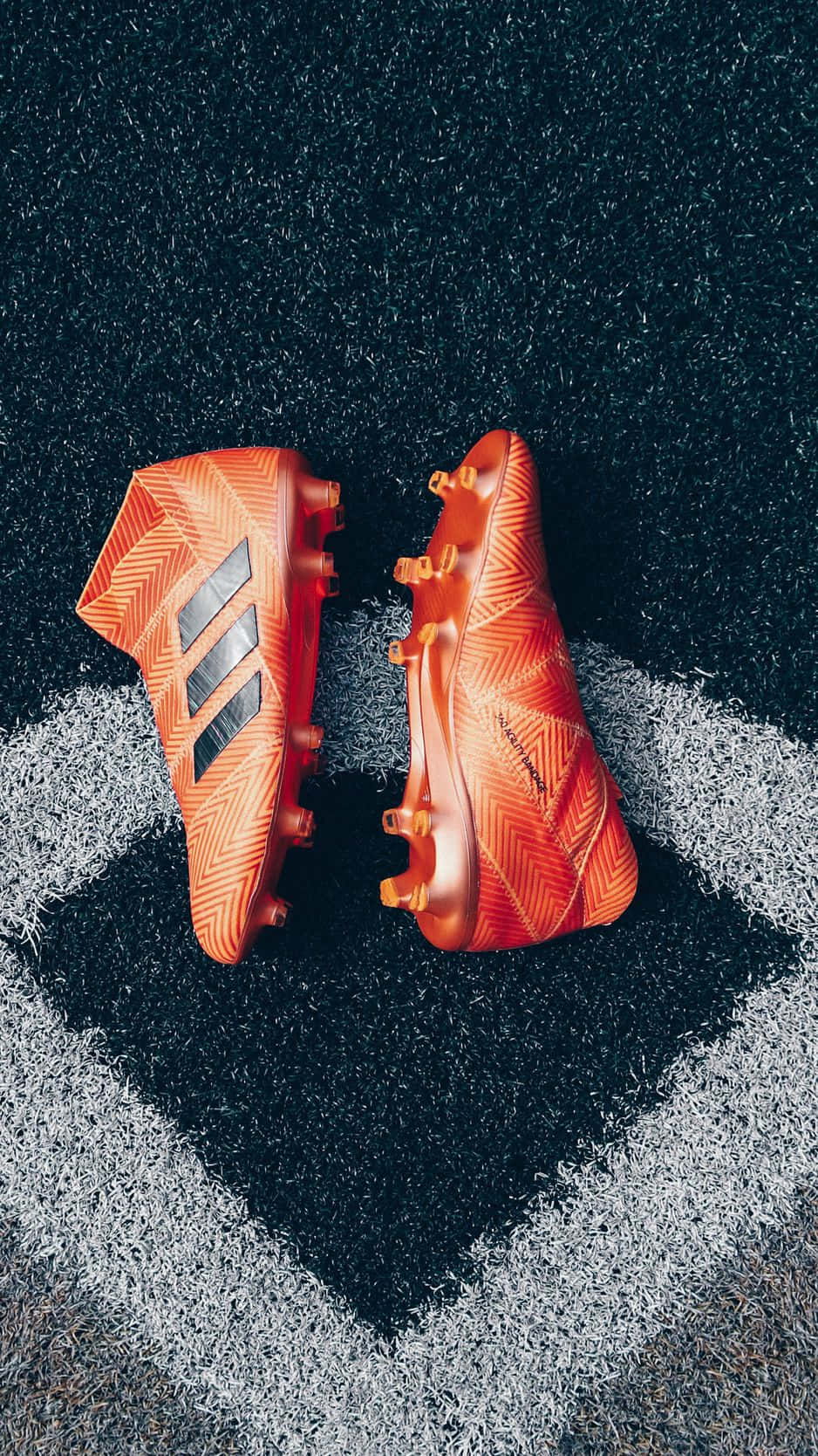 orange soccer cleats, black stripes, dark artificial turf field, HD Phone Wallpaper