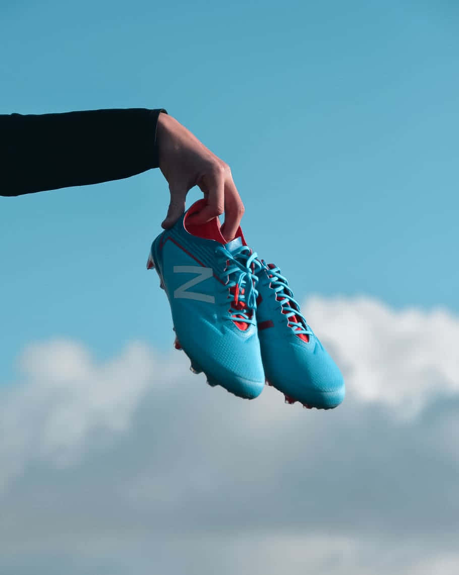 blue soccer cleats, clear blue sky, soft white clouds, SD Phone Wallpaper