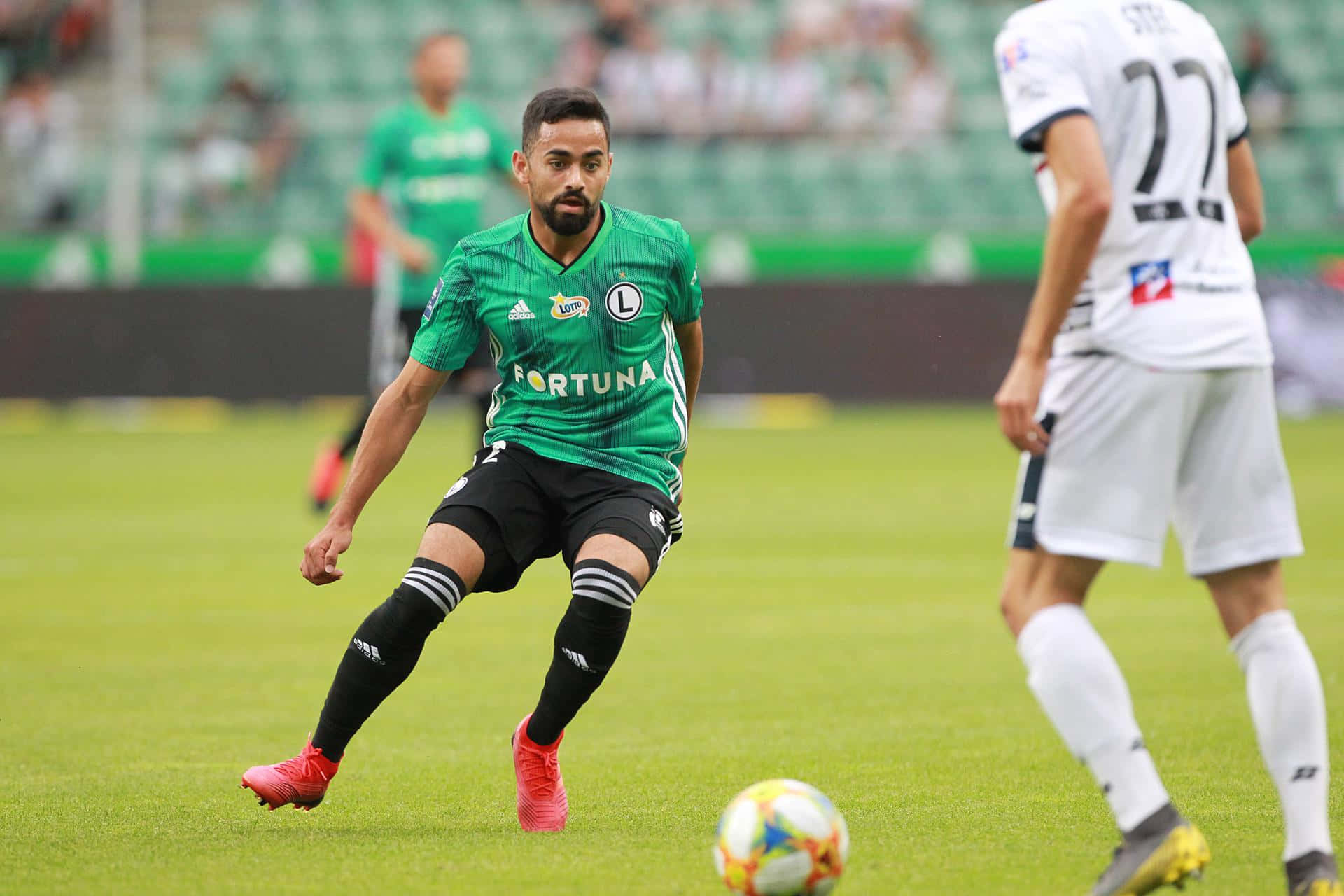 soccer player, green jersey, vibrant green pitch, Full HD Desktop Wallpaper