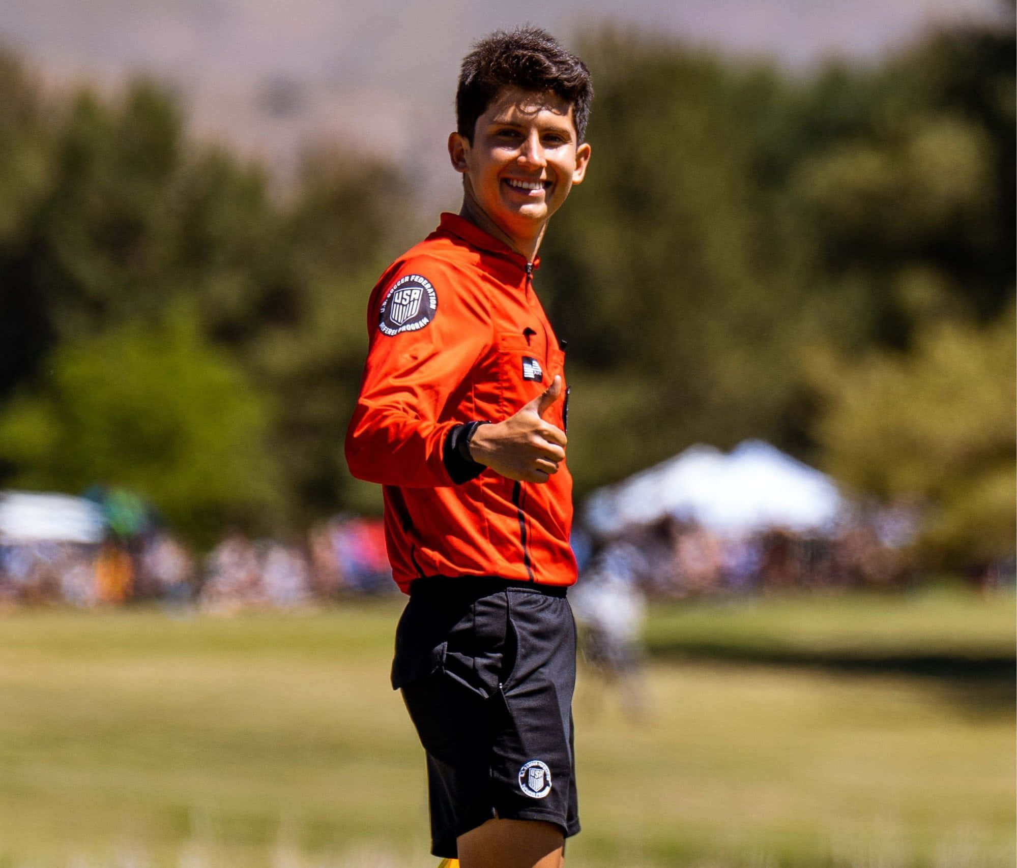 soccer referee, bright orange uniform, thumbs up, Full HD Desktop Wallpaper
