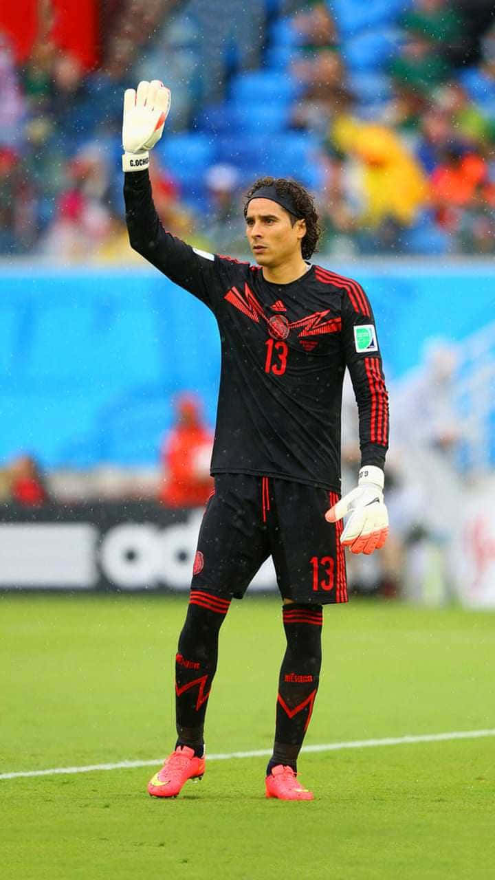 soccer goalkeeper, black and red uniform, rainy green pitch, HD Phone Wallpaper