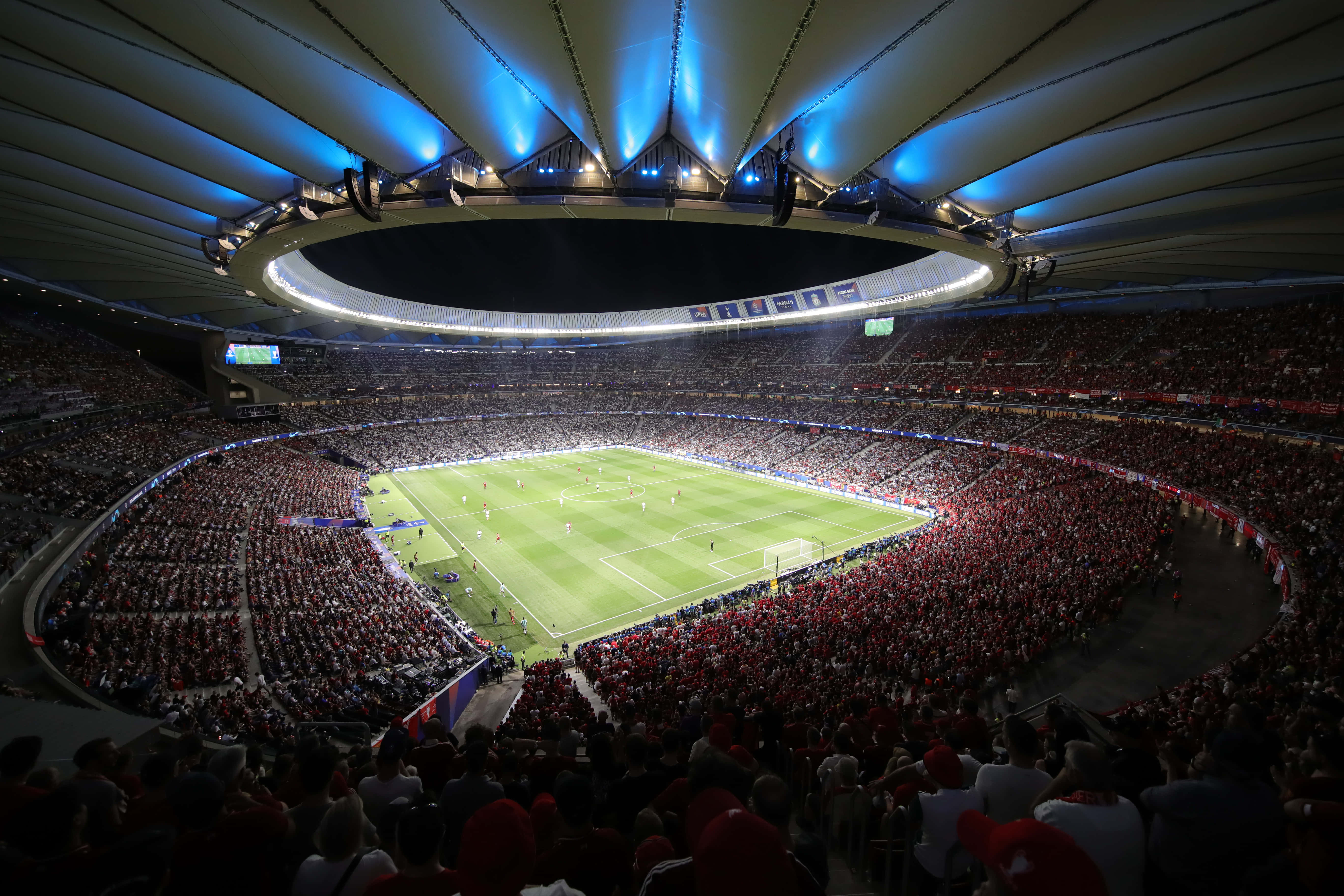 Soccer Stadium, glowing blue roof lights, vibrant green pitch, 5K Desktop Wallpaper
