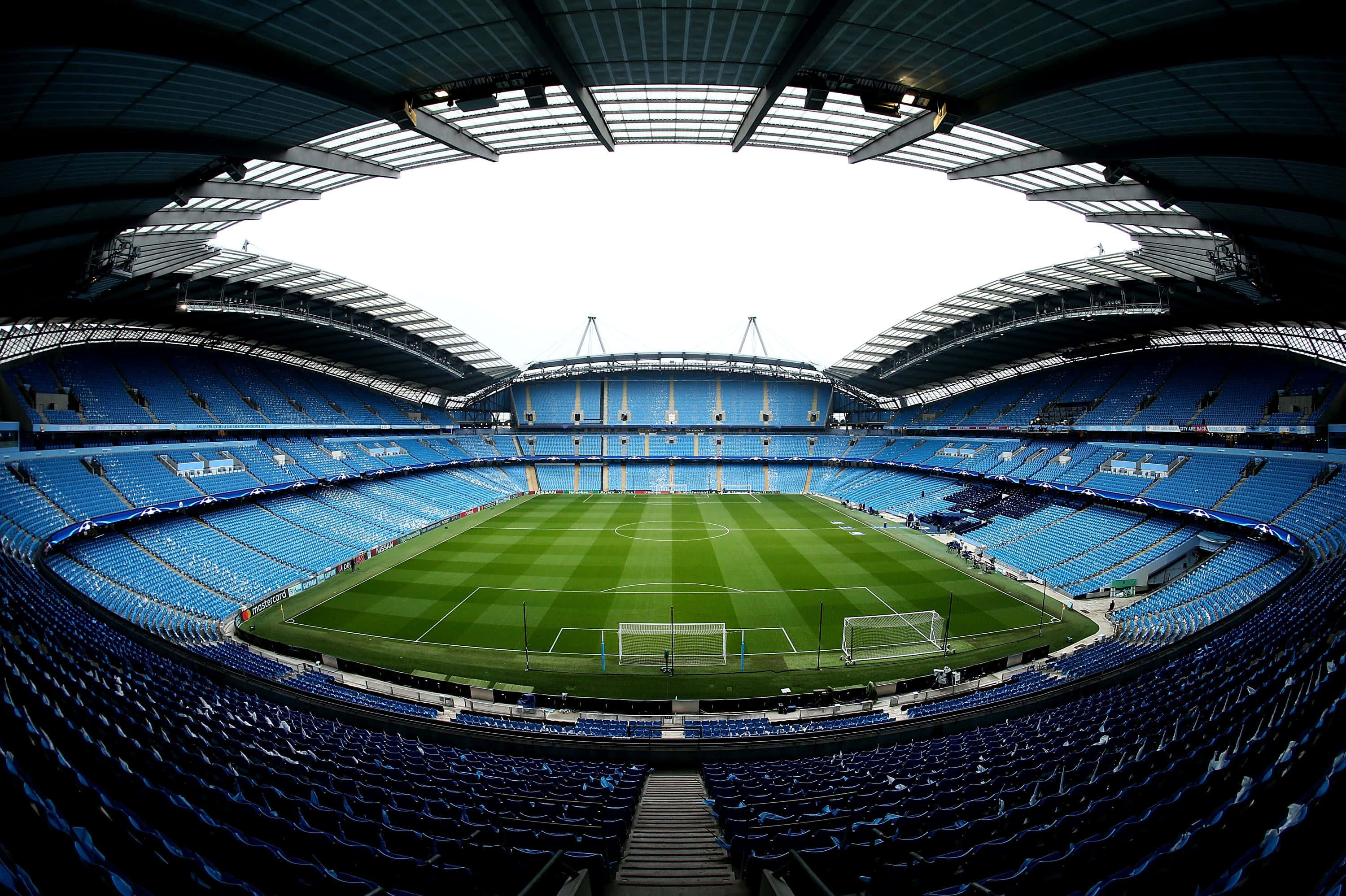 Soccer Stadium, blue seats, vibrant green pitch, 2K Desktop Wallpaper