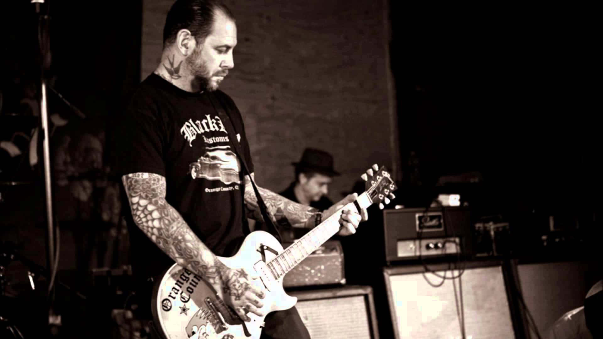 Social Distortion, white electric guitar, dimly lit stage, Full HD Desktop Wallpaper