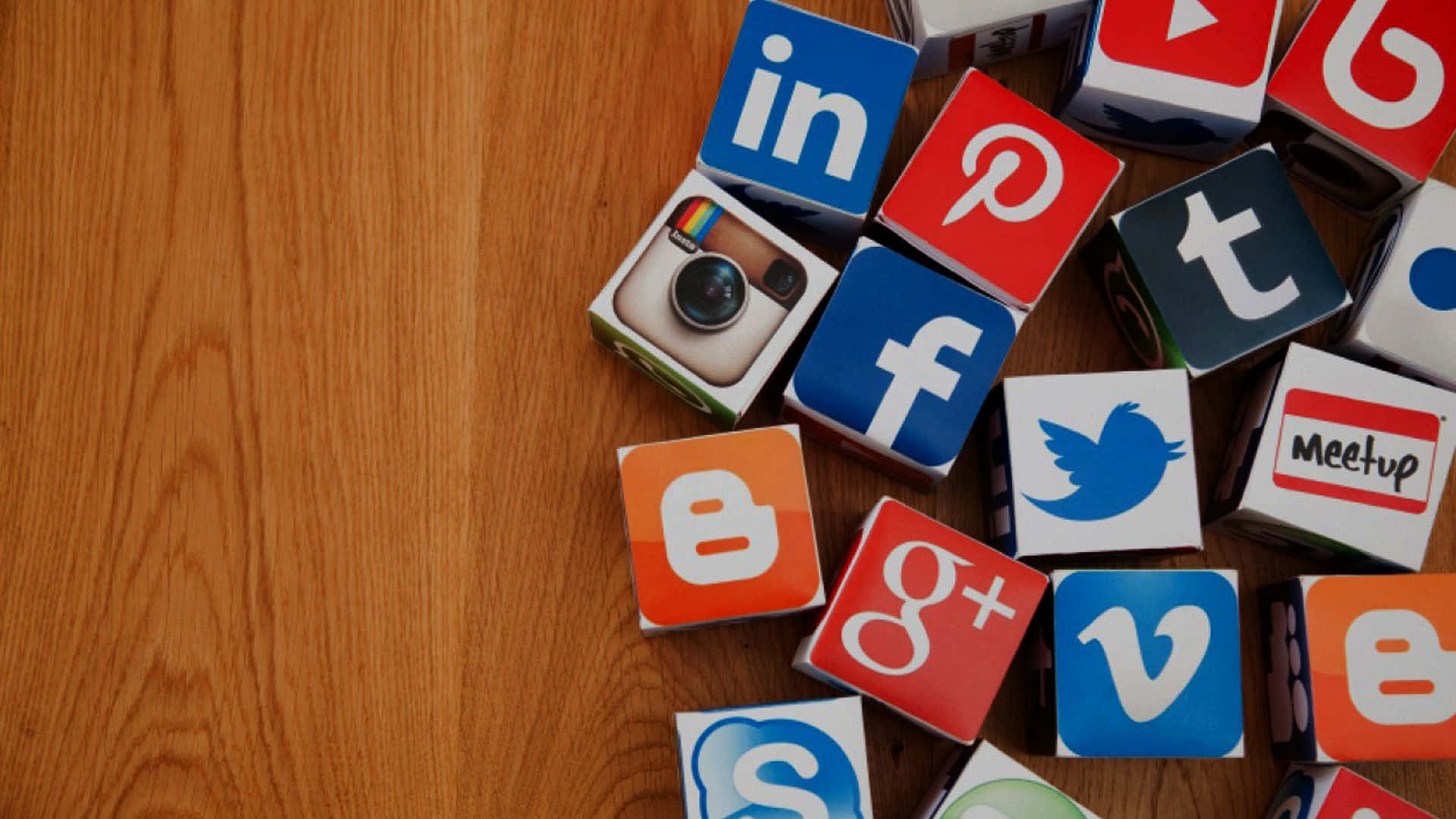 Social Media Apps, colorful social media logo blocks, warm wooden surface, Full HD Desktop Wallpaper