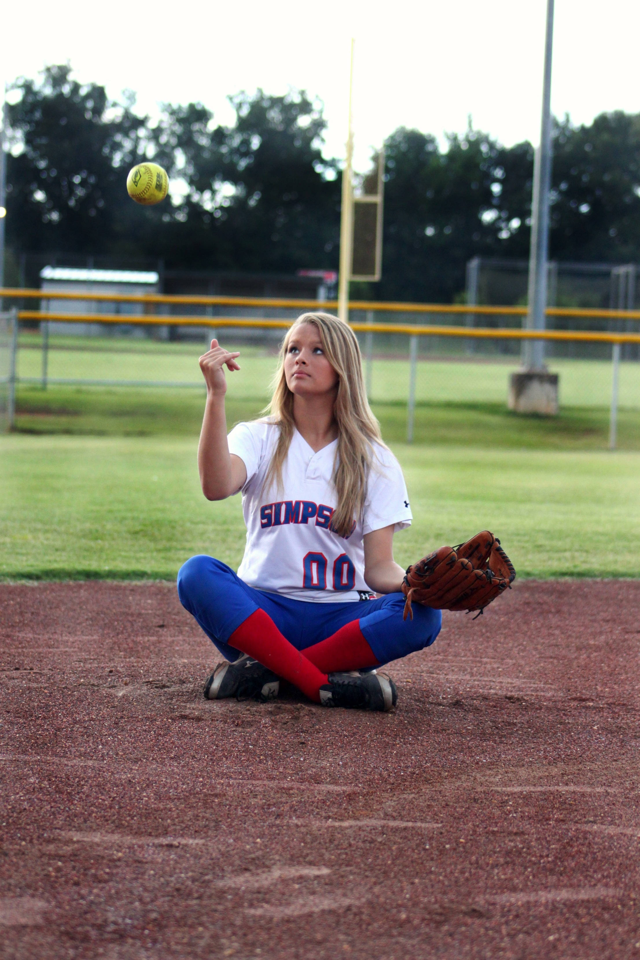 softball player, red dirt field, yellow ball, 2K Phone Wallpaper