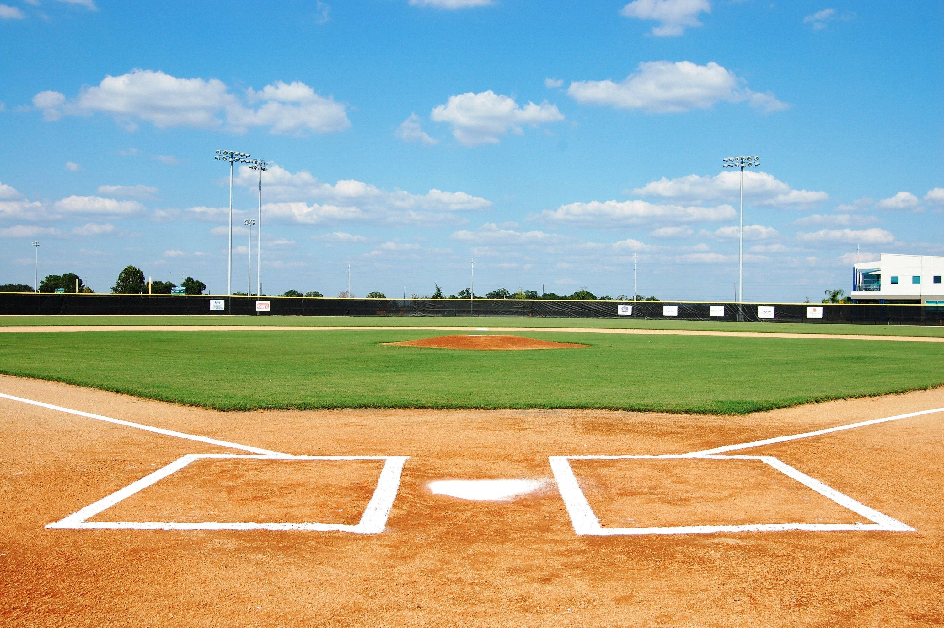 softball field, crisp white bases, vibrant green grass, 2K Desktop Wallpaper