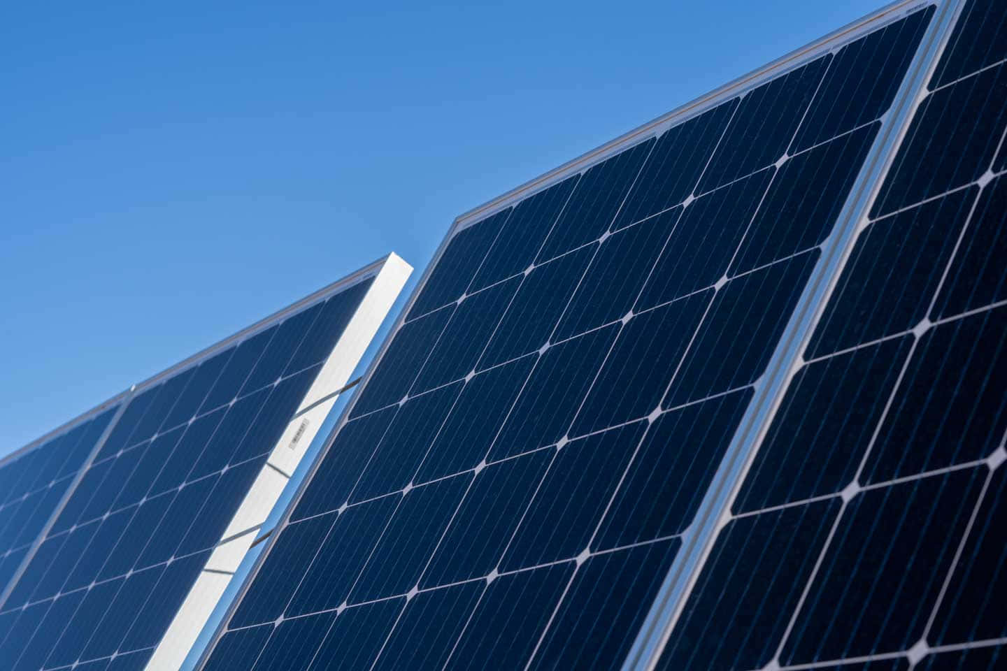 sleek blue solar panels, clear bright blue sky, low angle view, HD Desktop Wallpaper