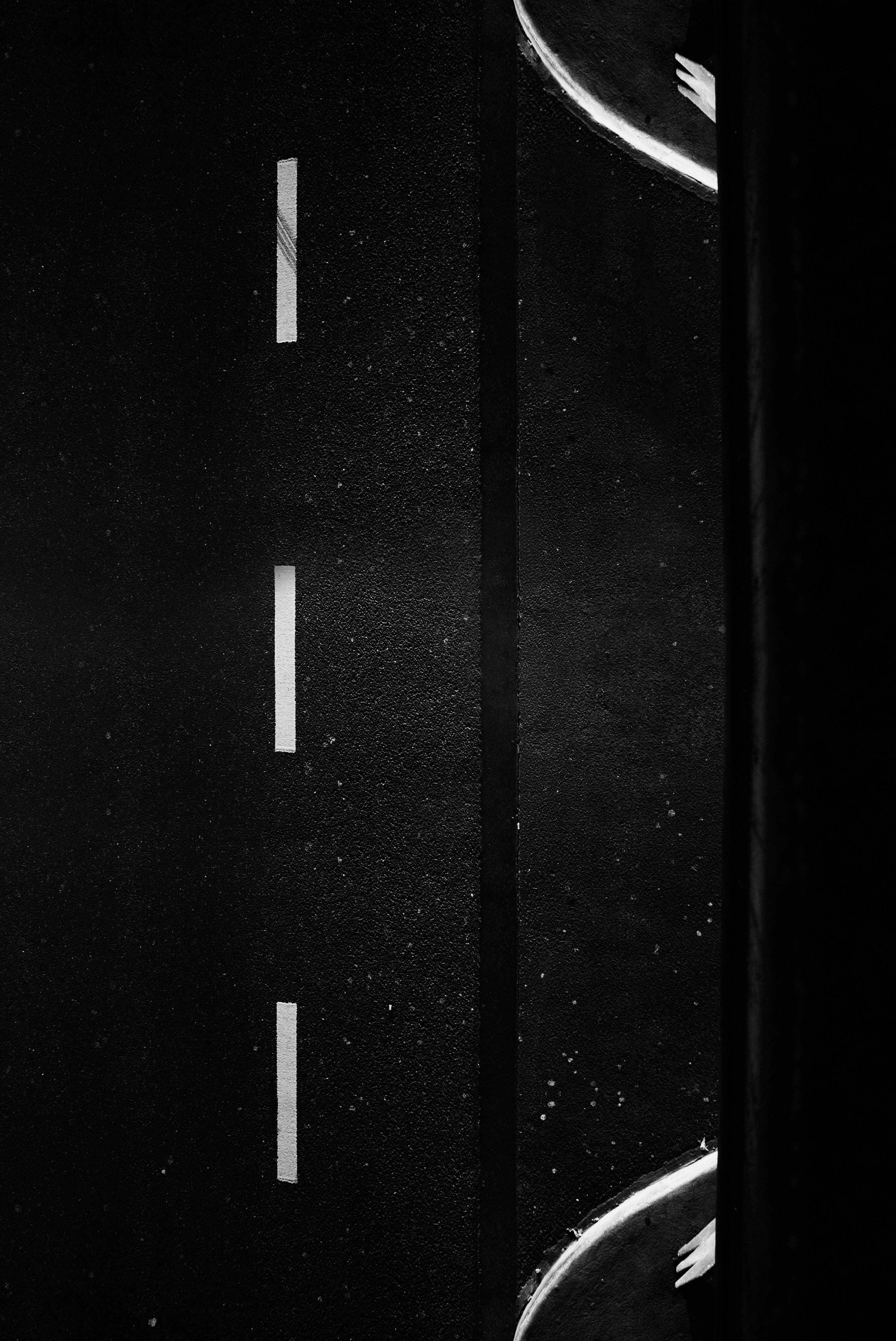 Solid Black iPhone, winding road, dashed lane markings, 4K Phone Wallpaper