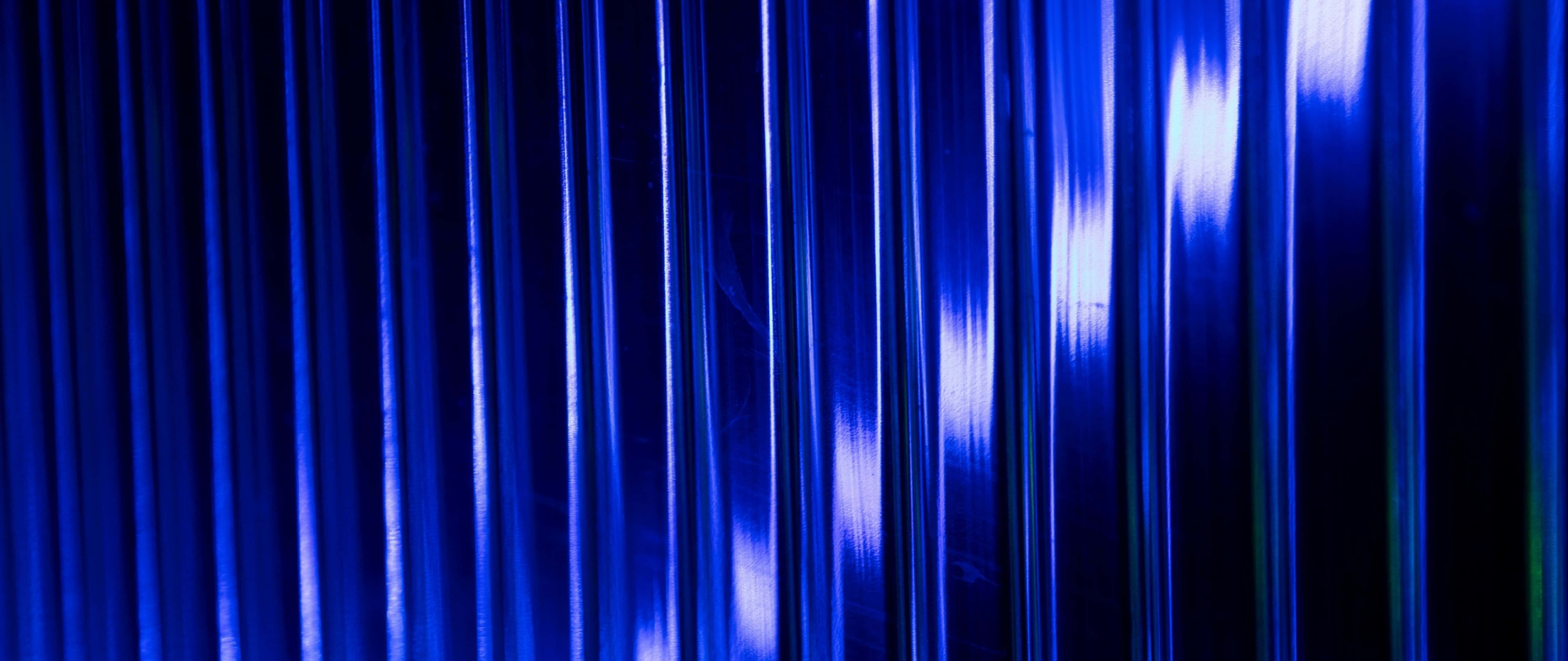 shiny blue steel, vertical blue light streaks, dark background, 5K Desktop Wallpaper
