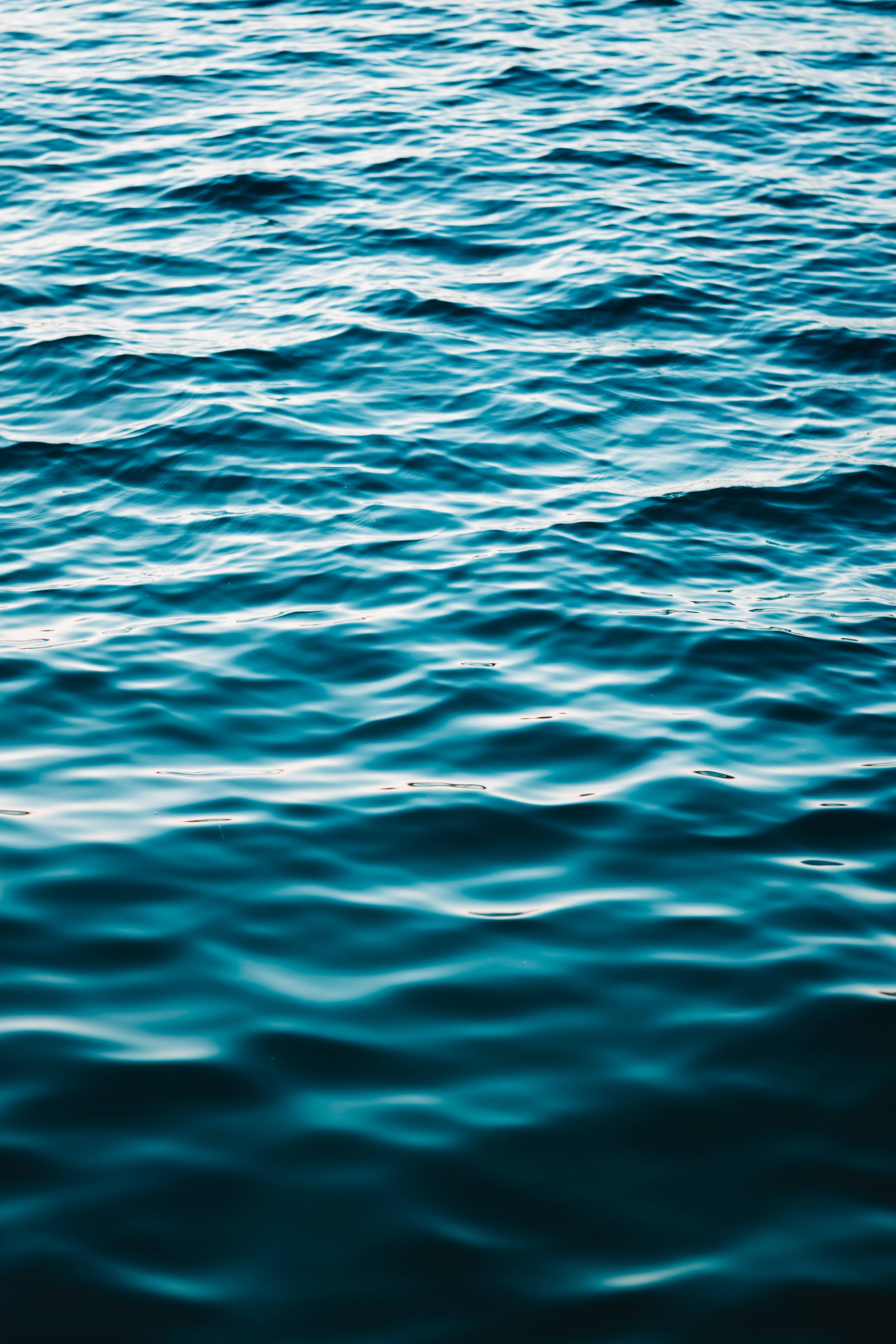 solid dark blue, sea water surface, deep teal ocean waves, 5K Phone Wallpaper