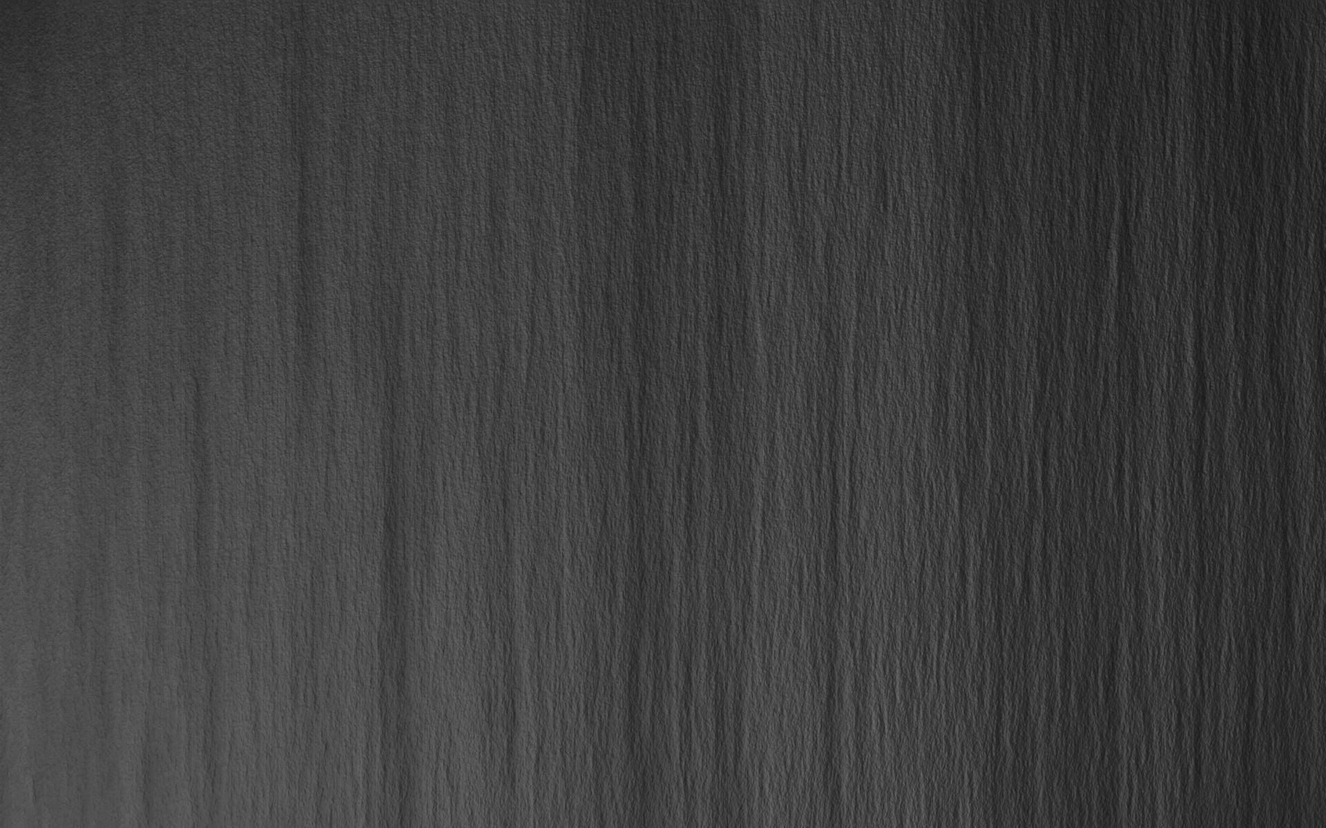 dark gray textured paper, subtle vertical ridges, soft shadows, Full HD Desktop Wallpaper