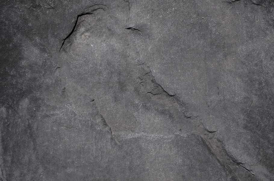 dark gray rock surface, natural cracks, subtle texture variations, SD Desktop Wallpaper