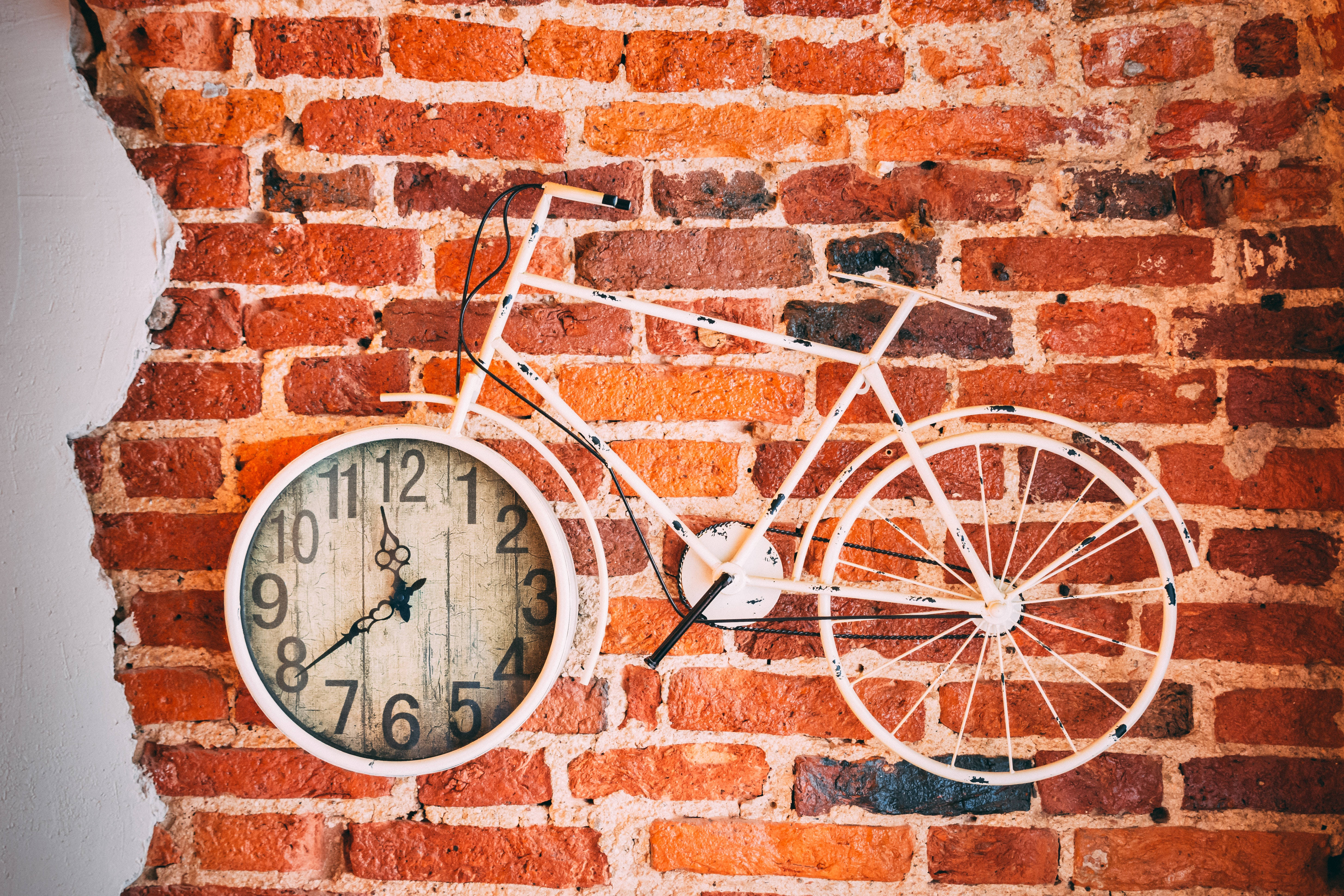 Solid Pastel Color Bicycle Clock, white bicycle clock, rustic red brick wall, 5K Desktop Wallpaper
