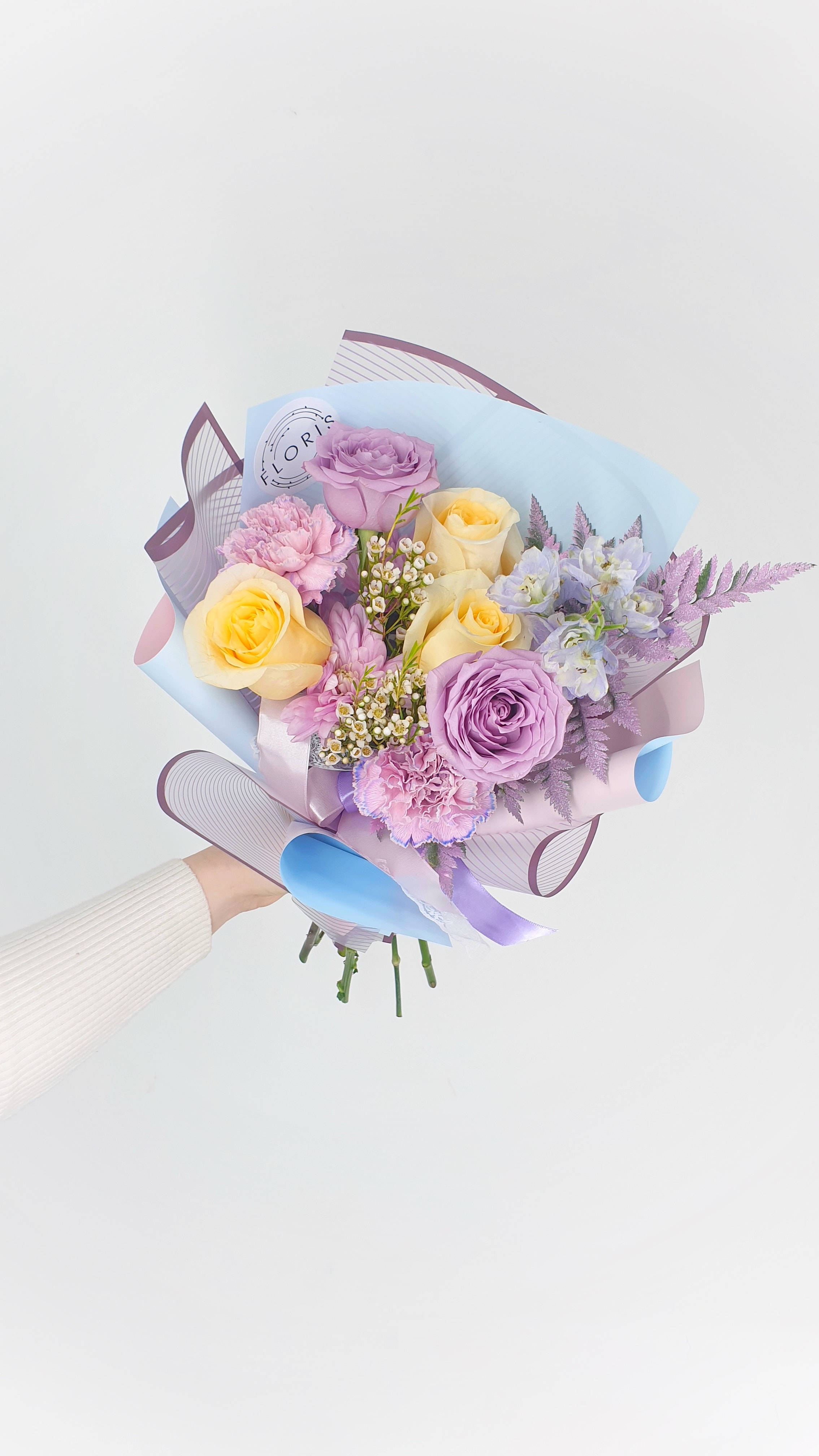 pastel bouquet, purple yellow and pink flowers, light blue paper, 4K Phone Wallpaper