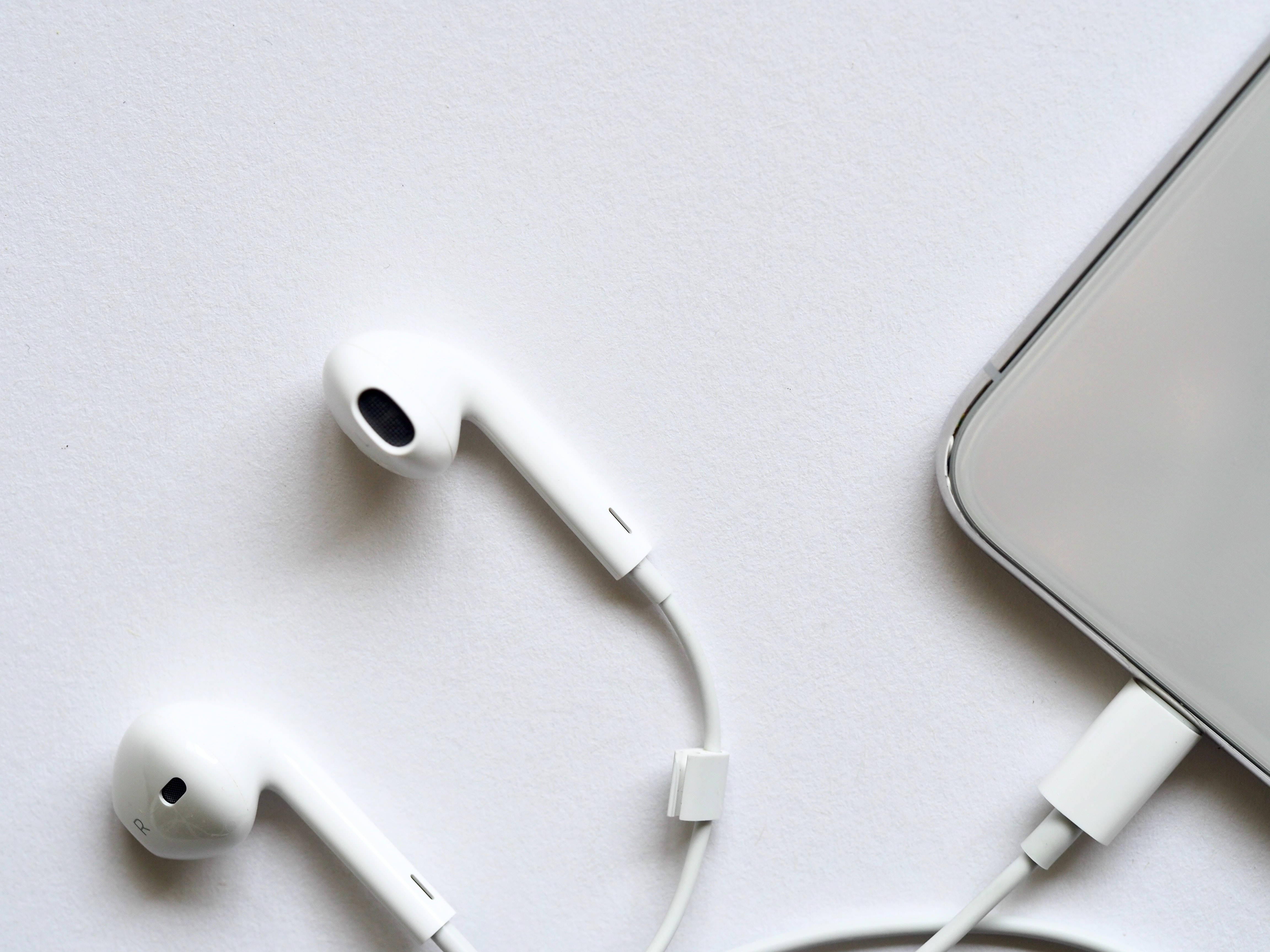 white wired earphones, phone, clean white surface, 4K Desktop Wallpaper