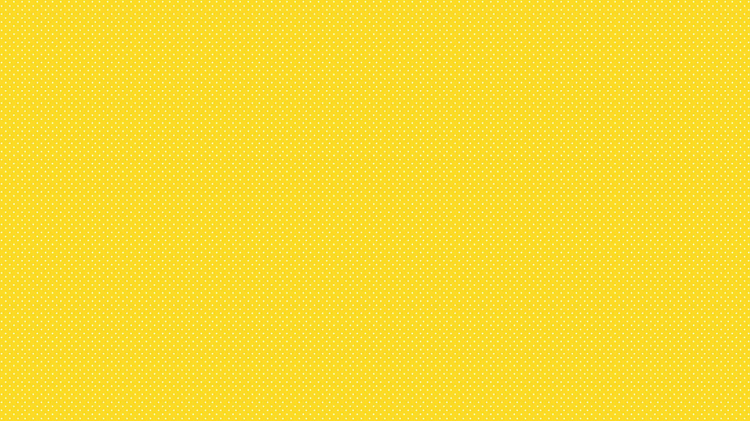 Solid Yellow, vibrant yellow, subtle repeating dot pattern, 2K Desktop Wallpaper