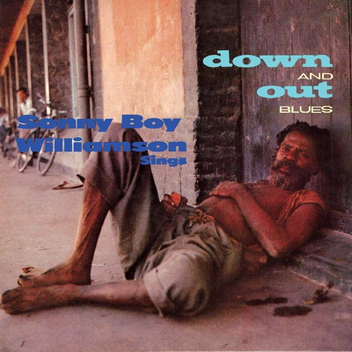 Sonny Boy Williamson II, weathered brick wall, sunlit sidewalk, SD Desktop Wallpaper