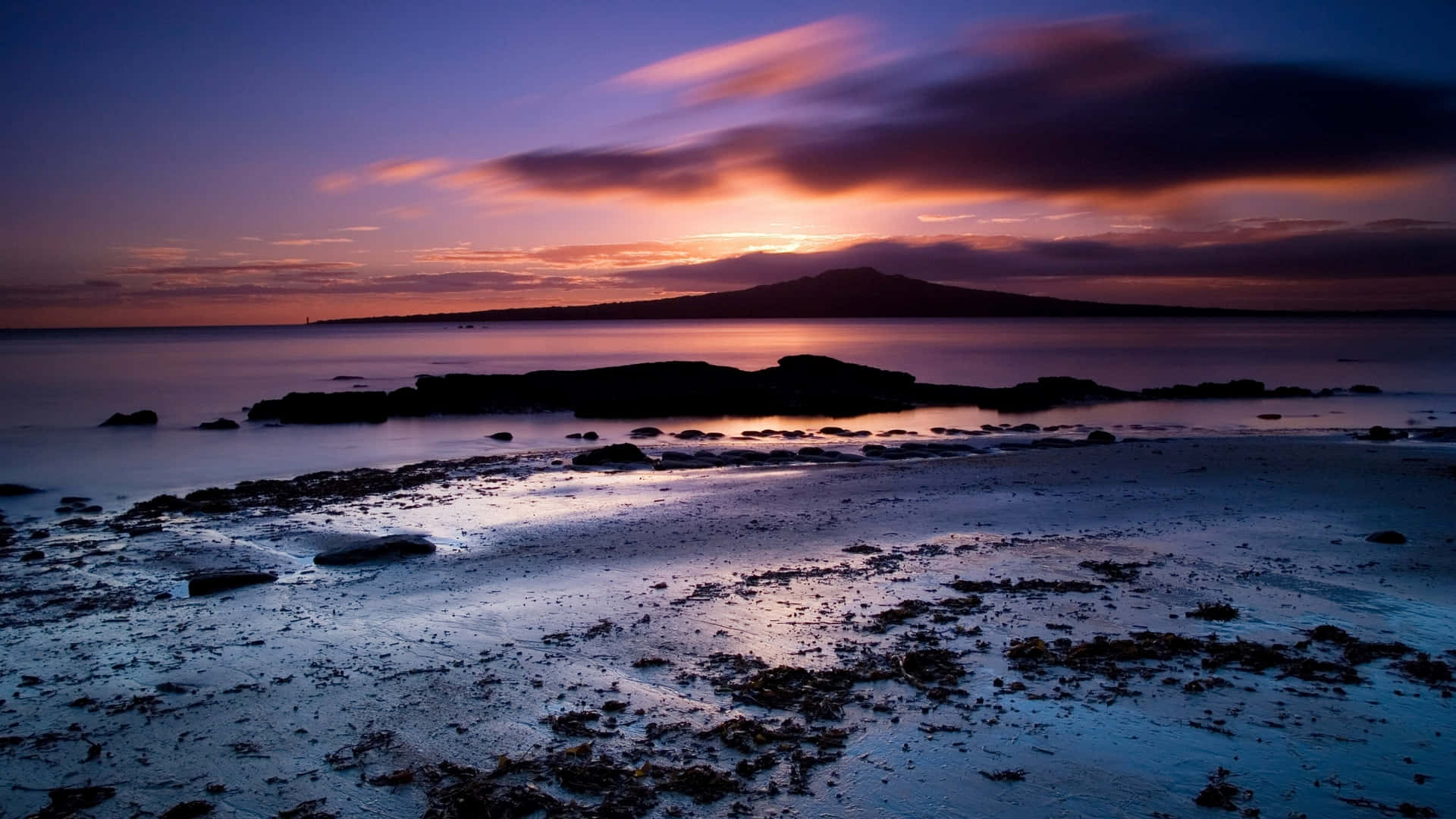 twilight seascape, distant mountain silhouette, vibrant purple and orange sky, Full HD Desktop Wallpaper