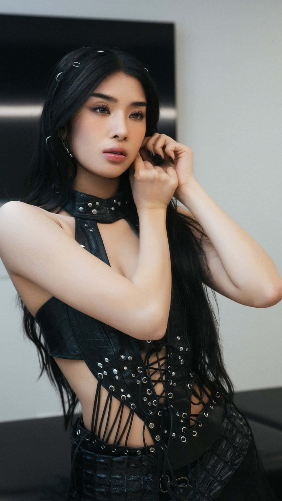 Sophia Katseye, long black hair, studded black leather outfit, Full HD Phone Wallpaper