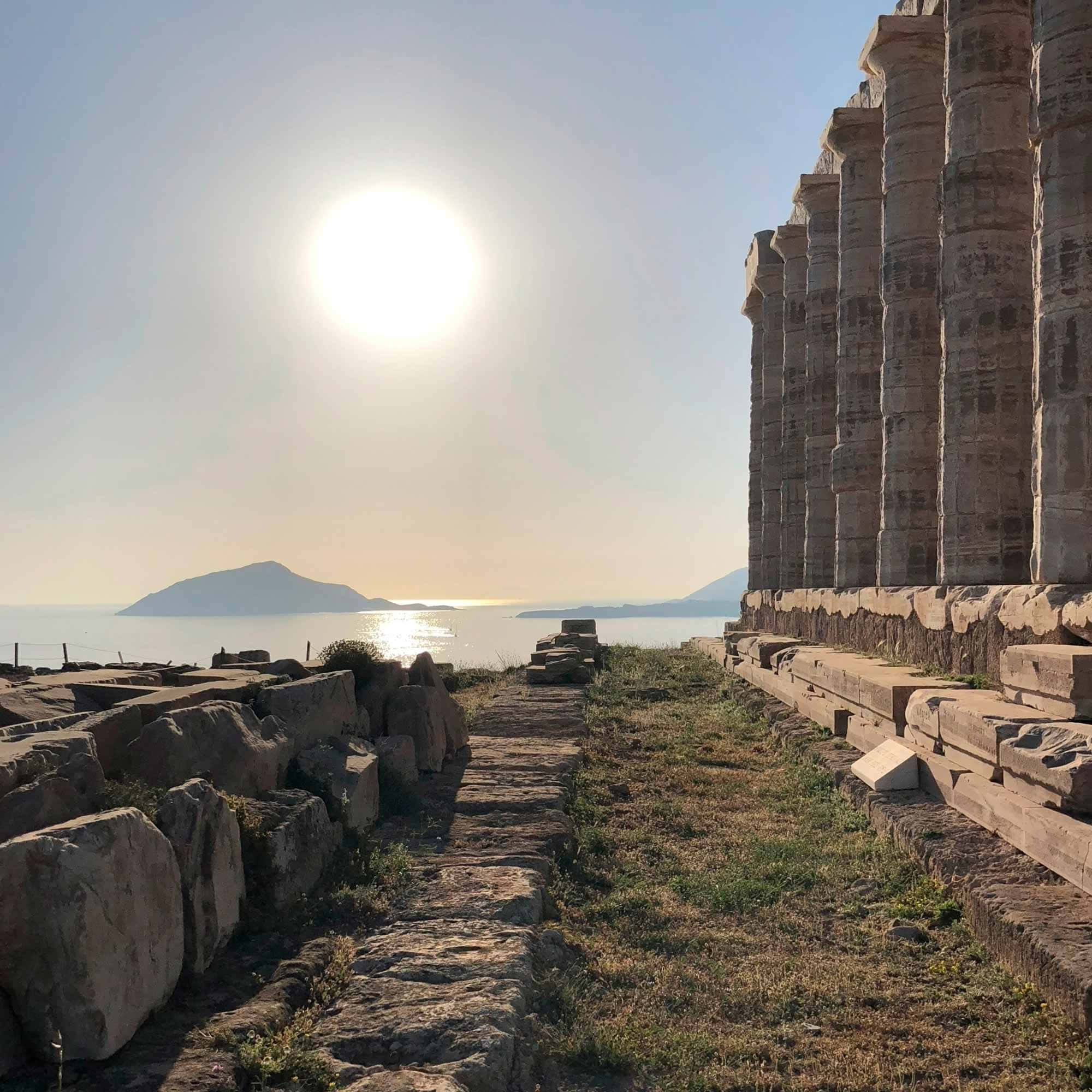 Sounion, ancient stone temple columns, sunlit coastal path, Full HD Desktop Wallpaper