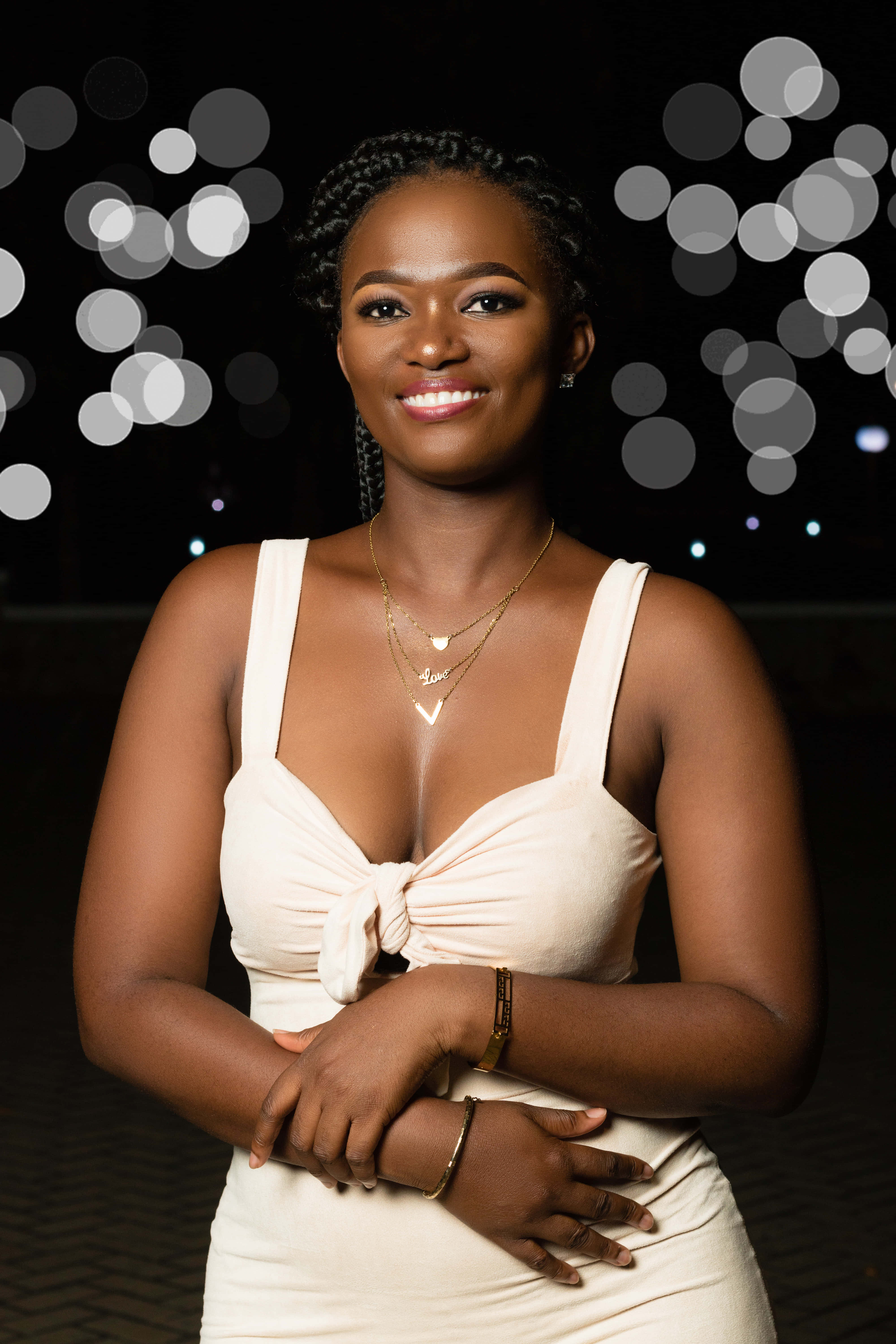 South African Woman, cream dress, glowing bokeh lights, 5K Phone Wallpaper