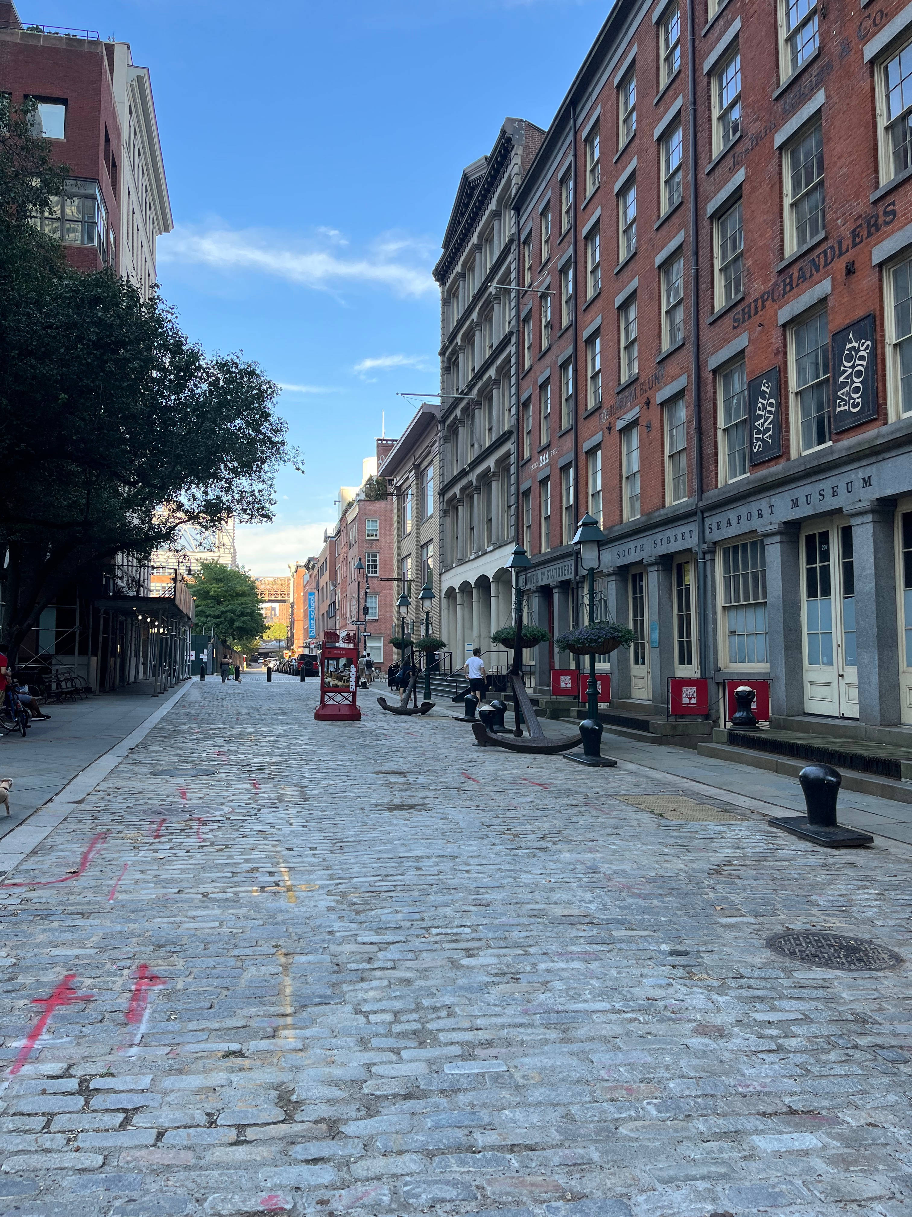 South Street Seaport, cobblestone street, historic brick buildings, 4K Phone Wallpaper