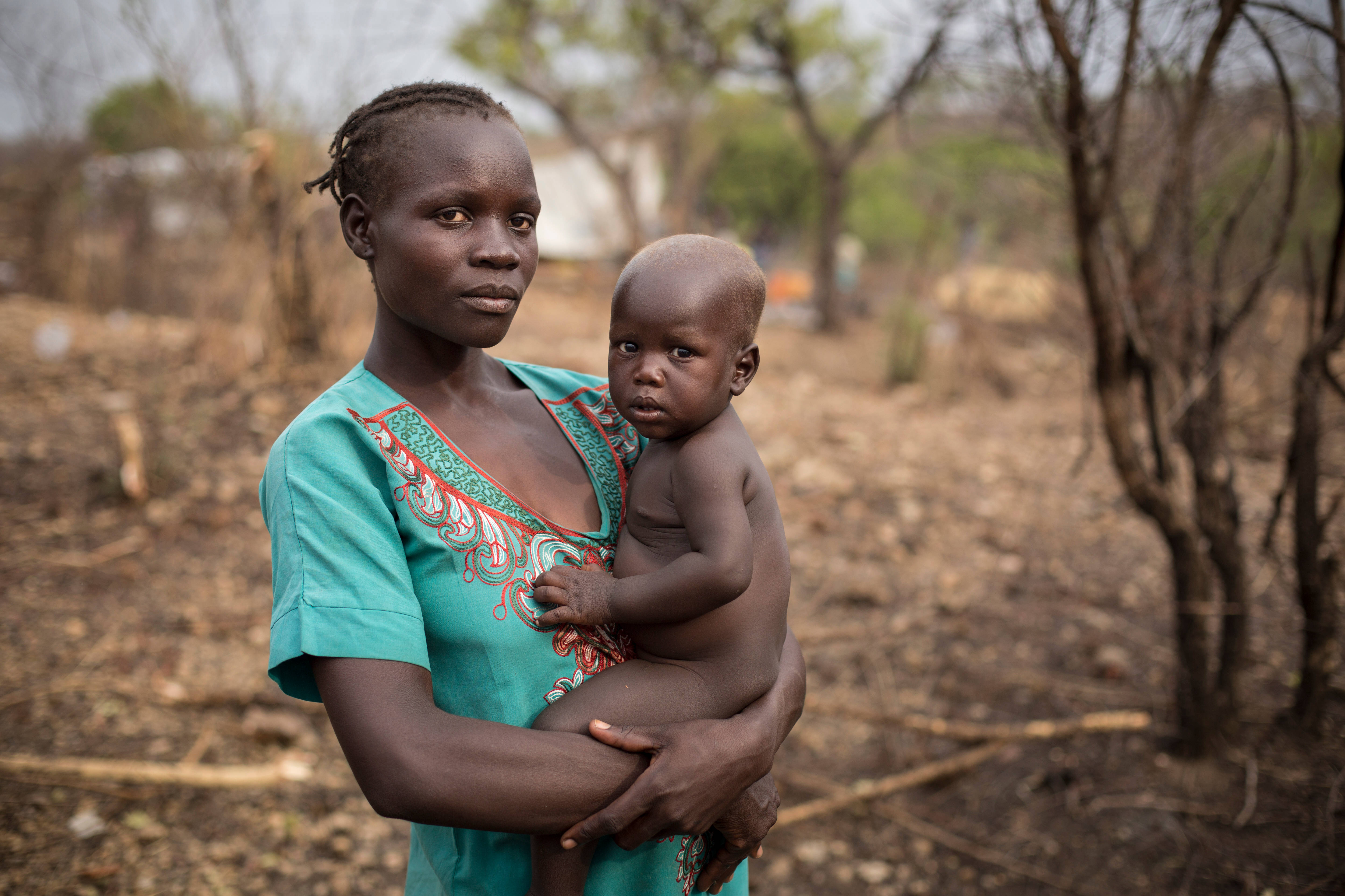 South Sudan, teal patterned shirt, bare-chested baby, 5K Desktop Wallpaper