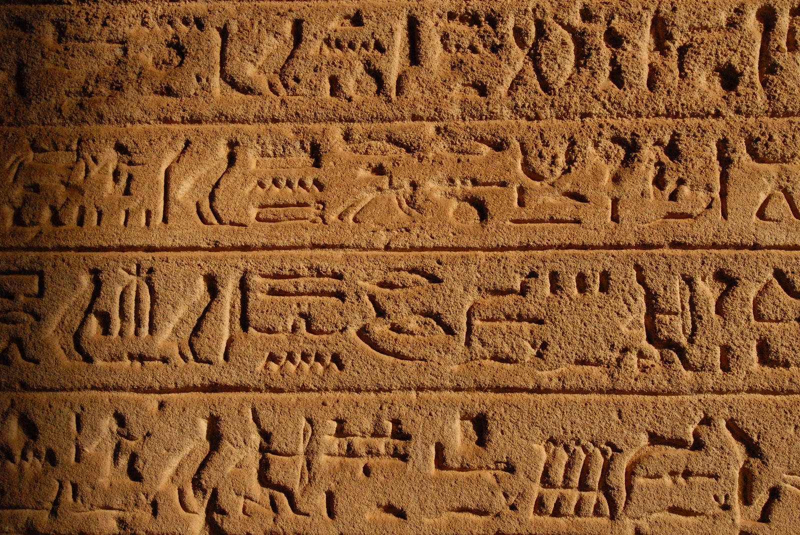 ancient Egyptian hieroglyphs, textured sandstone, warm golden lighting, HD Desktop Wallpaper