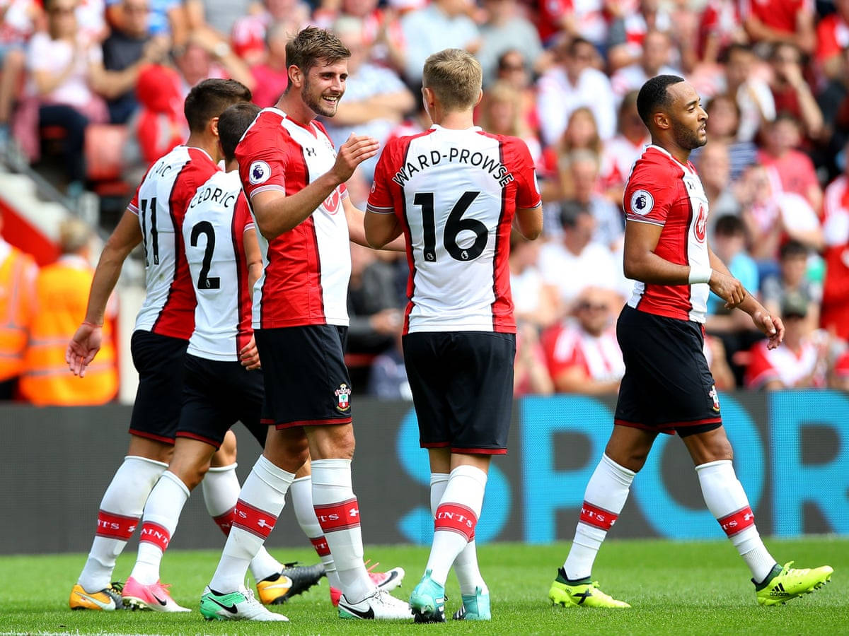 Southampton FC, red and white kits, sunlit green pitch, SD Desktop Wallpaper