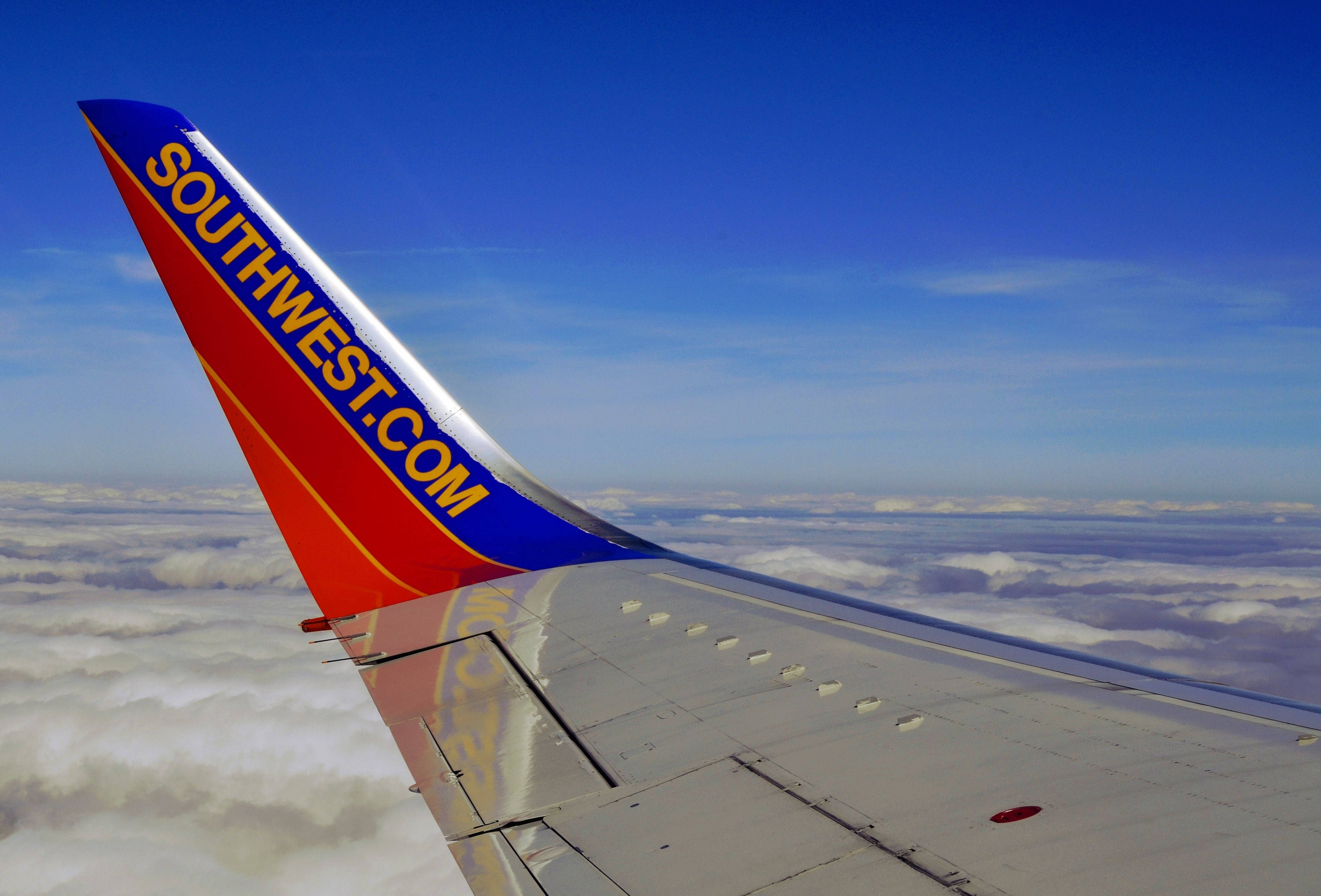 Southwest Airlines, airplane wing, fluffy white clouds, 4K Desktop Wallpaper