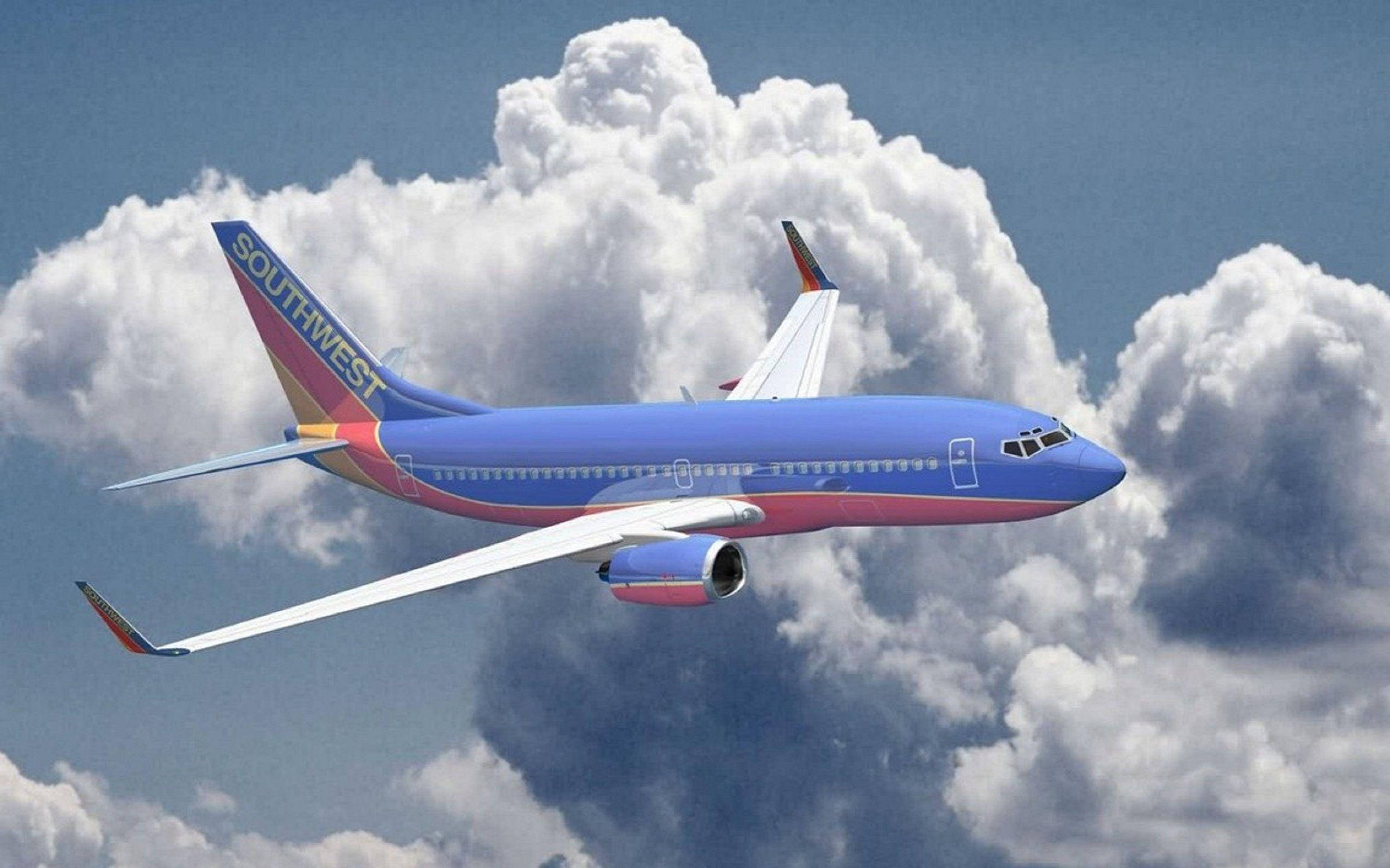 Southwest Airlines, plane, fluffy white clouds, 2K Desktop Wallpaper