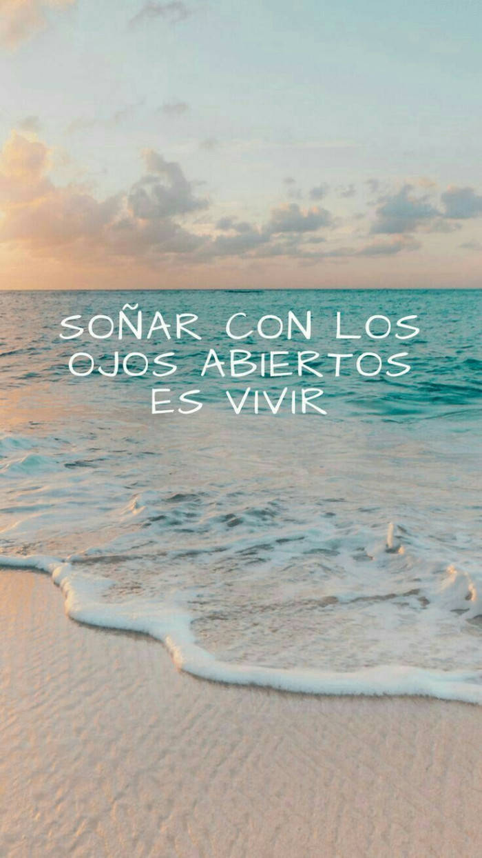 pastel sunset sky, golden sand, Spanish text overlay, SD Phone Wallpaper