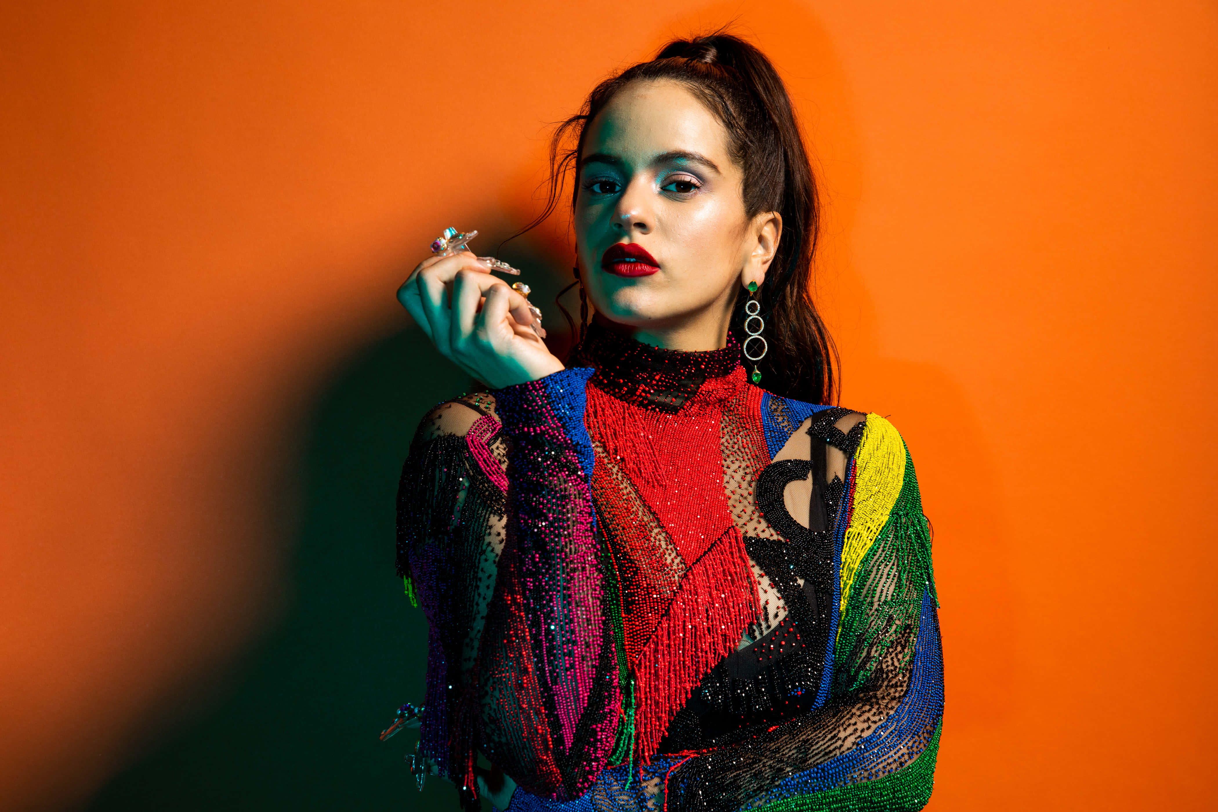 colorful beaded outfit, vibrant orange backdrop, dramatic lighting, 4K Desktop Wallpaper