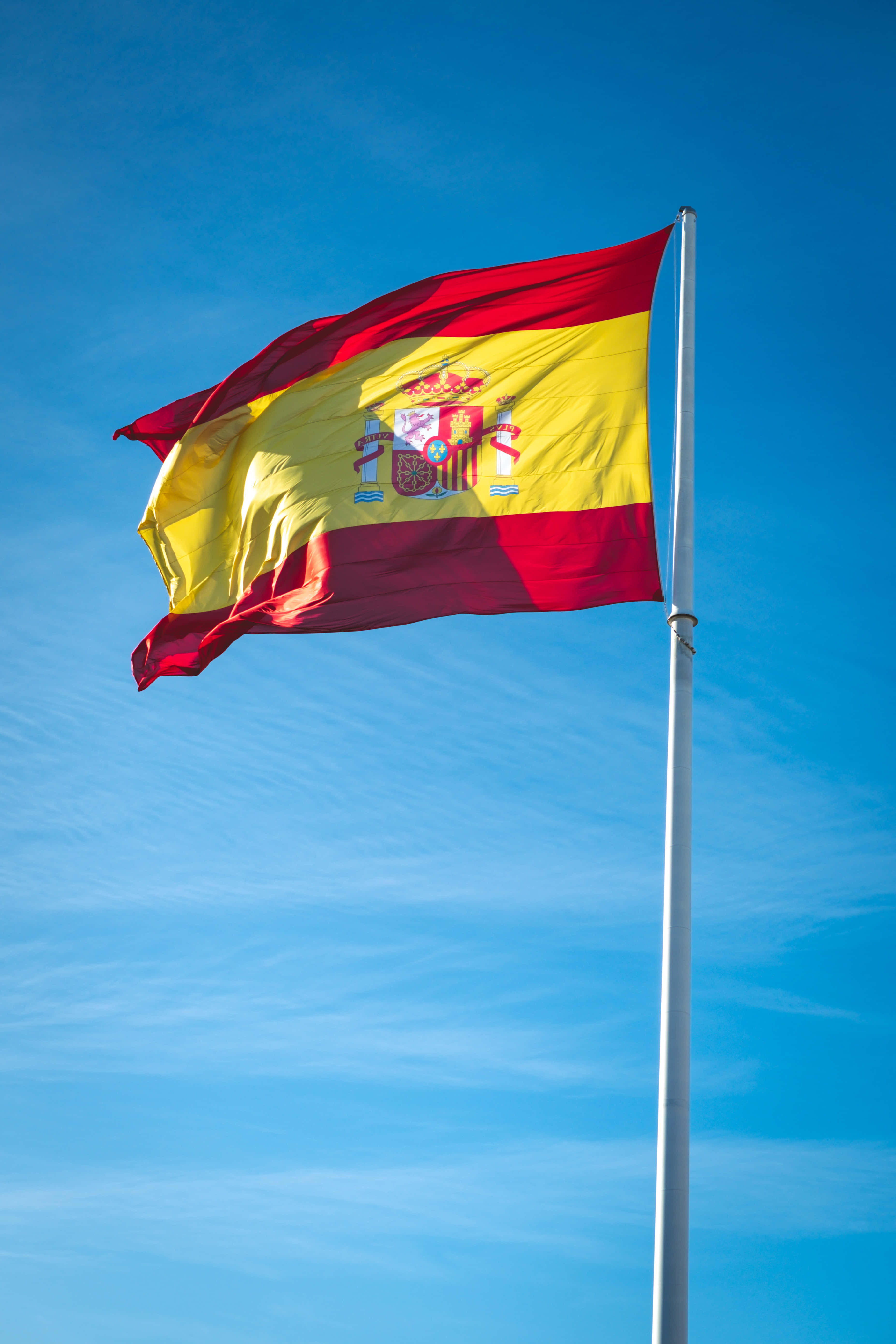 Spanish flag, clear blue sky, wispy clouds, 5K Phone Wallpaper