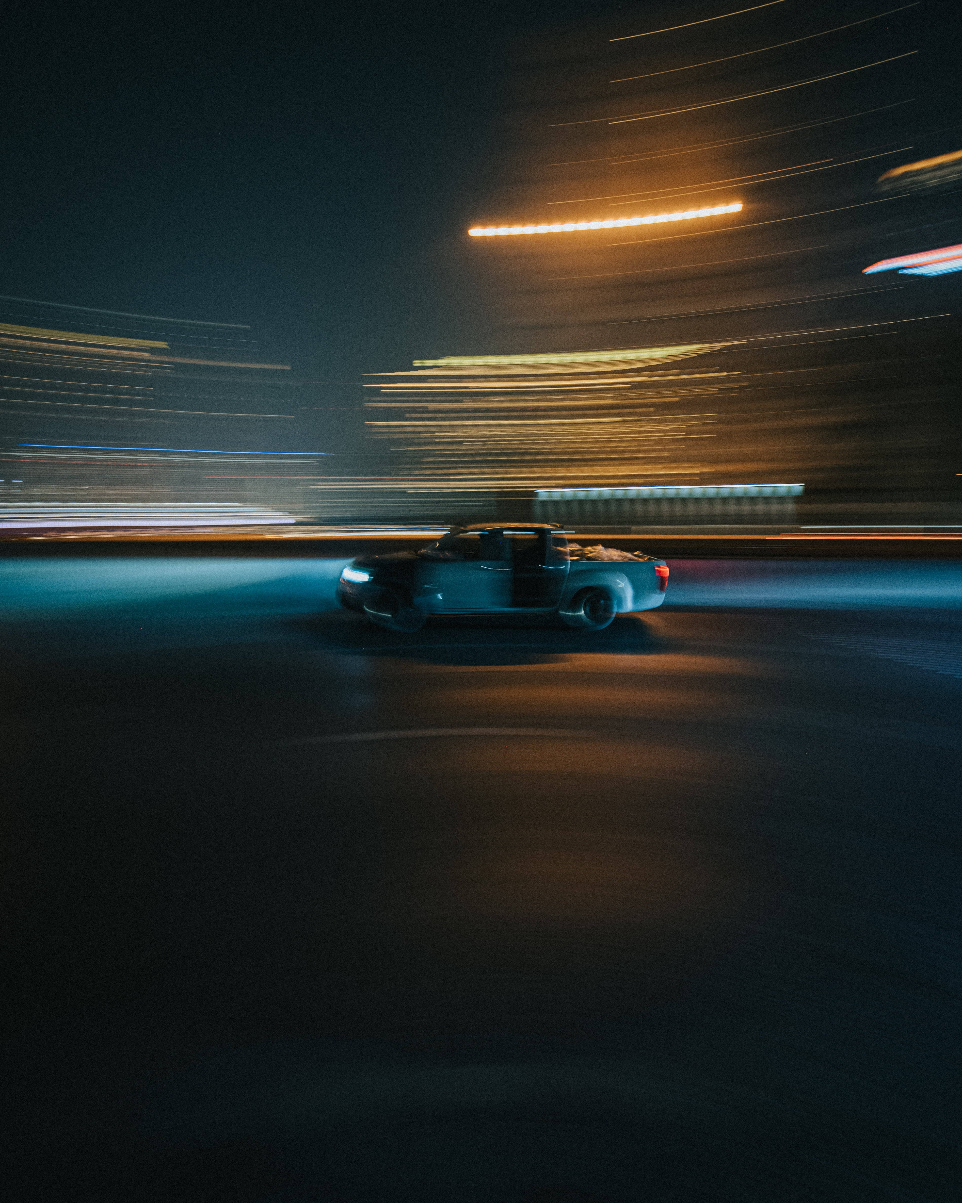 Speed iPhone, pickup truck, neon-lit city, 4K Phone Wallpaper