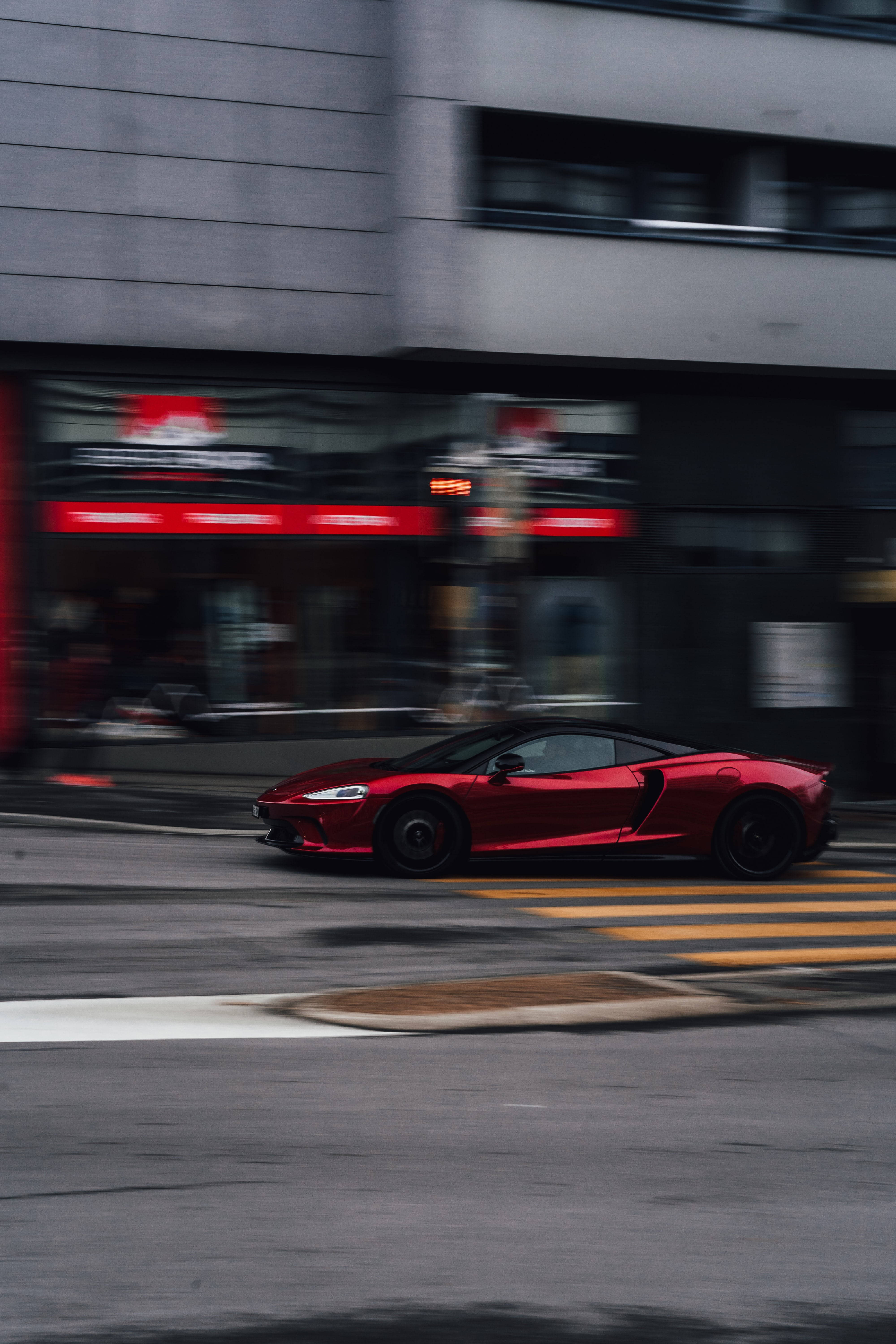 red and black sports car, city street, motion blur, 5K Phone Wallpaper