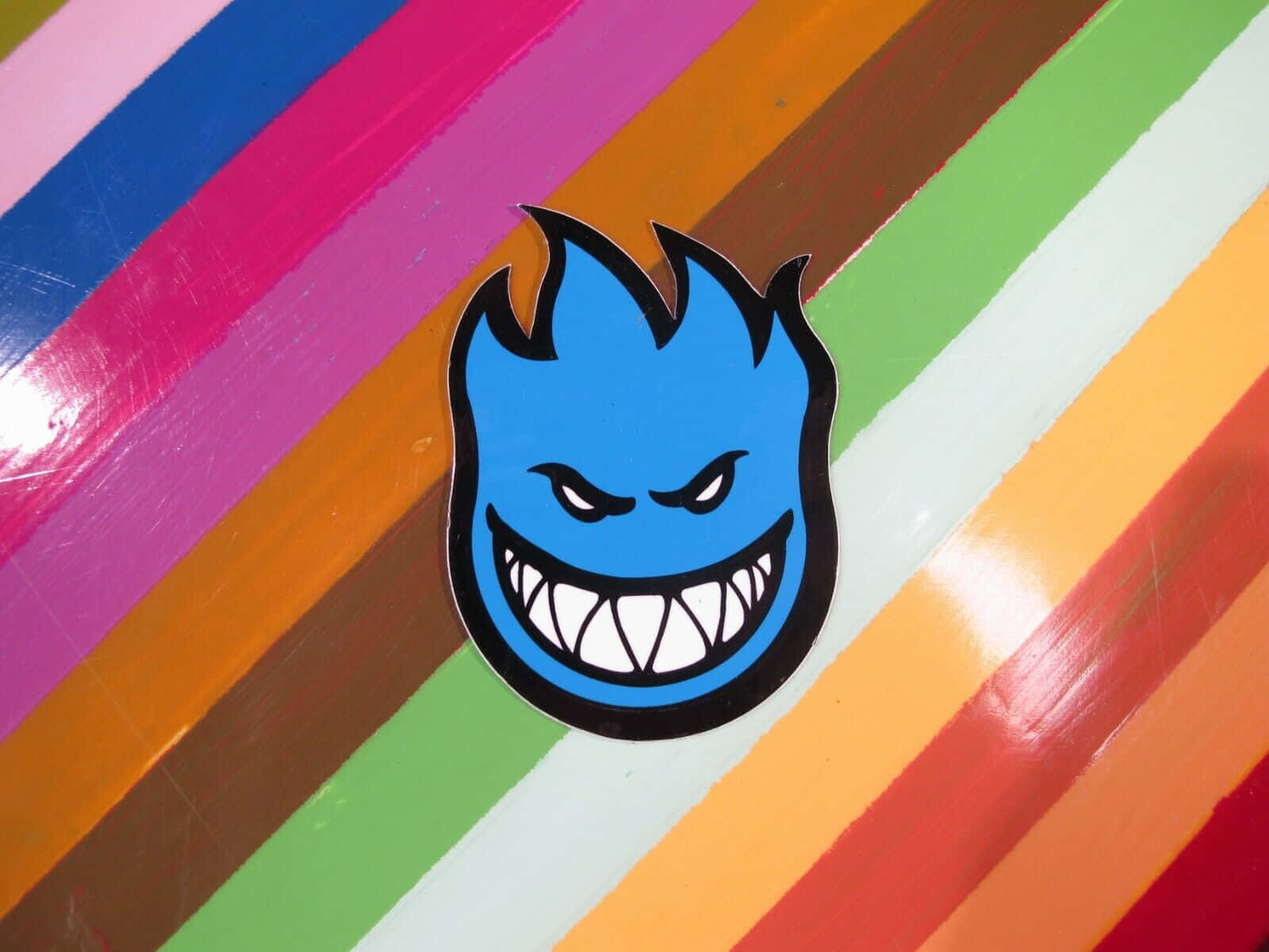 Spitfire Skate, blue flame-headed, grinning face, HD Desktop Wallpaper