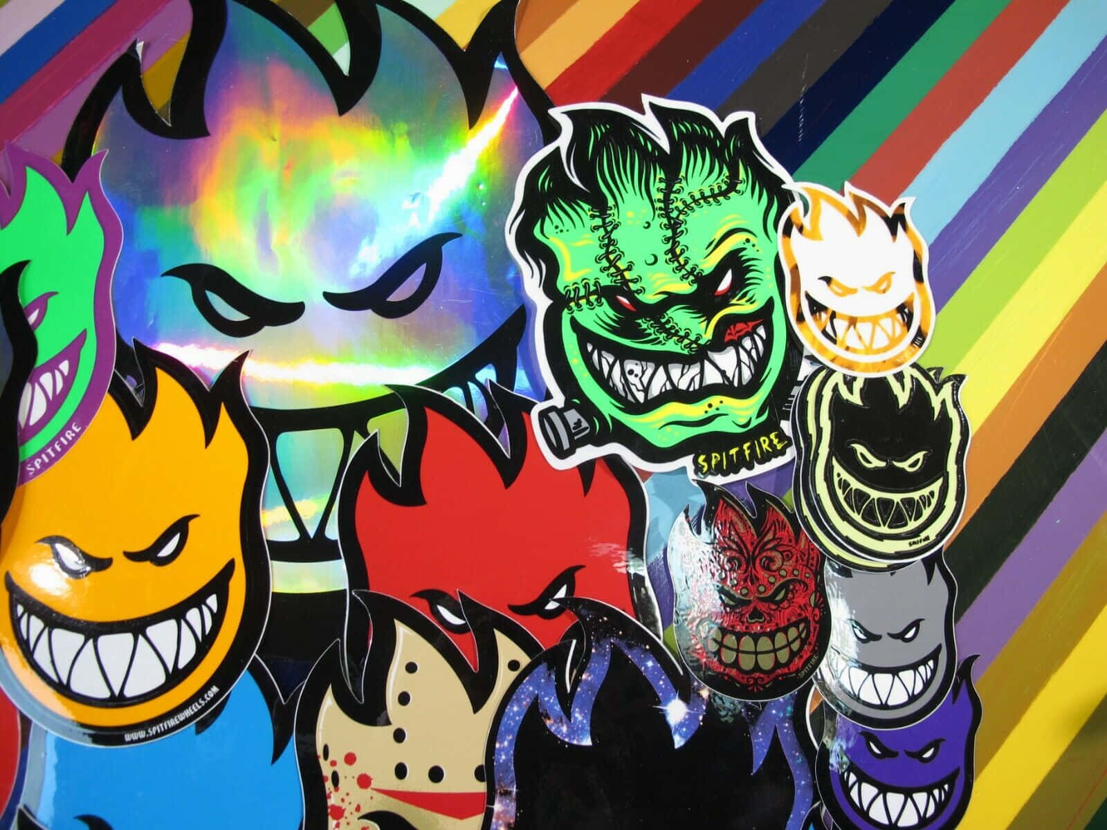 Spitfire Skate, cartoonish devil faces, rainbow striped background, HD Desktop Wallpaper