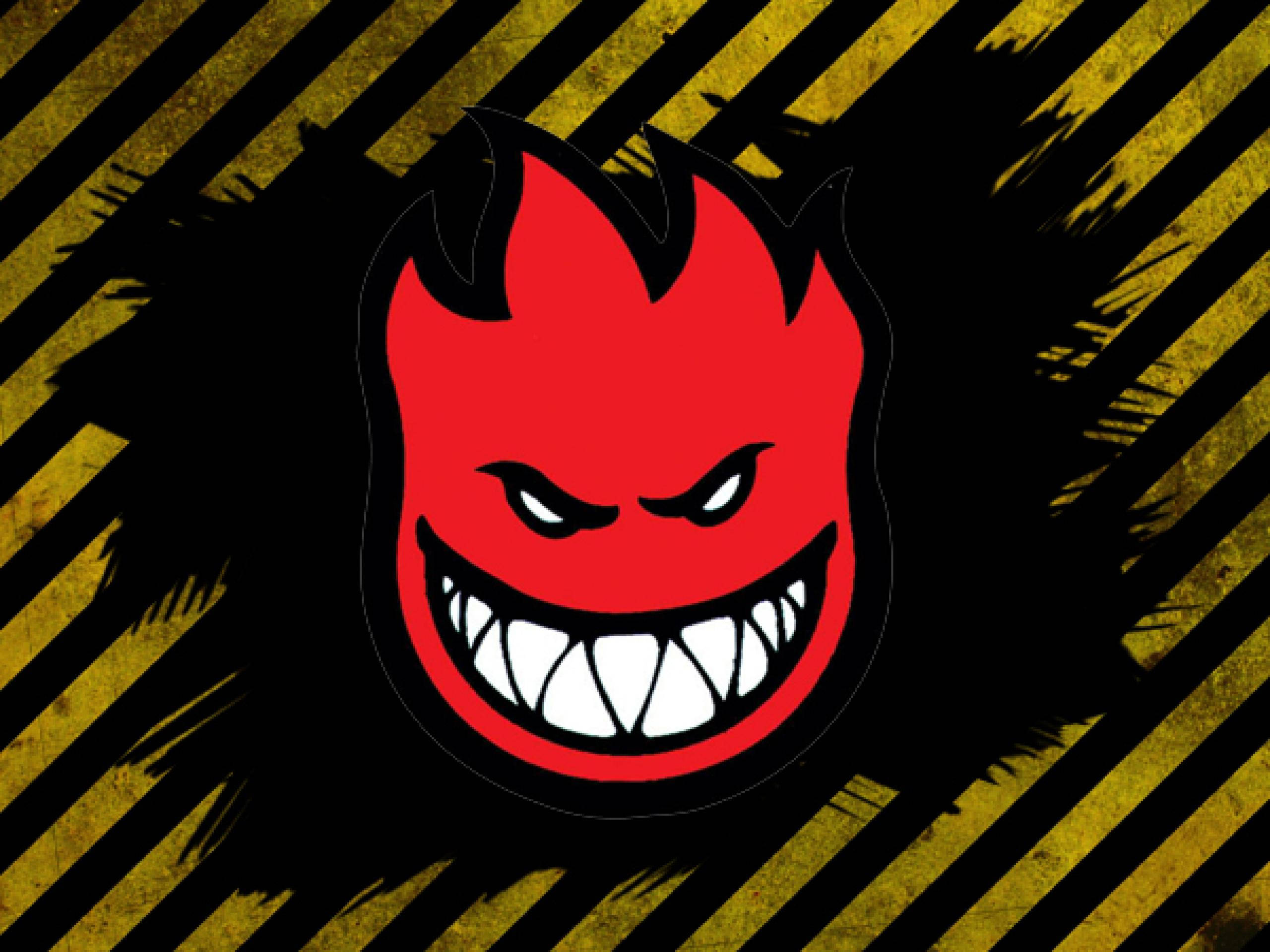 Spitfire, black and yellow background, red devil face, 2K Desktop Wallpaper