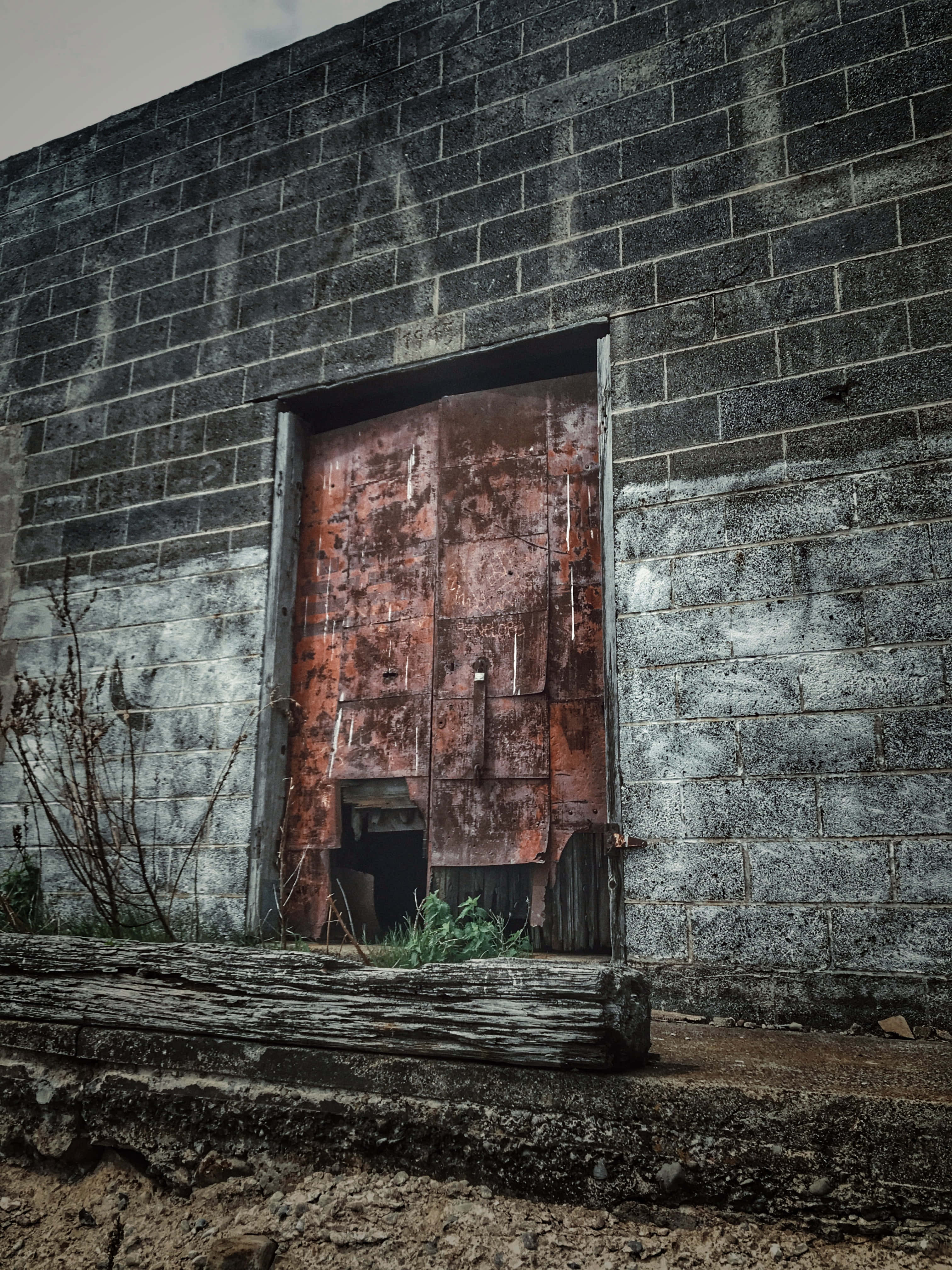 abandoned warehouse, rusted metal door, weathered concrete wall, 4K Phone Wallpaper