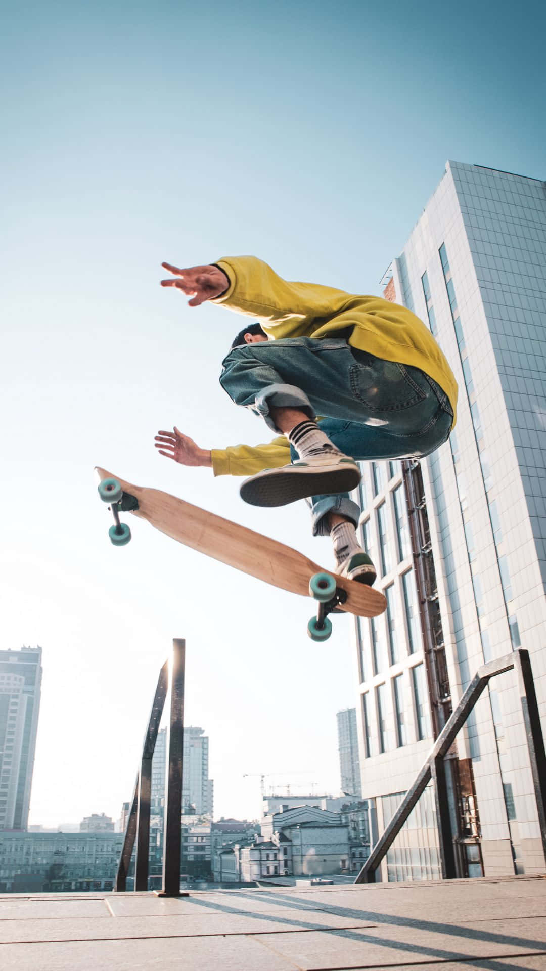 skateboarder, yellow hoodie, city rooftop, Full HD Phone Wallpaper