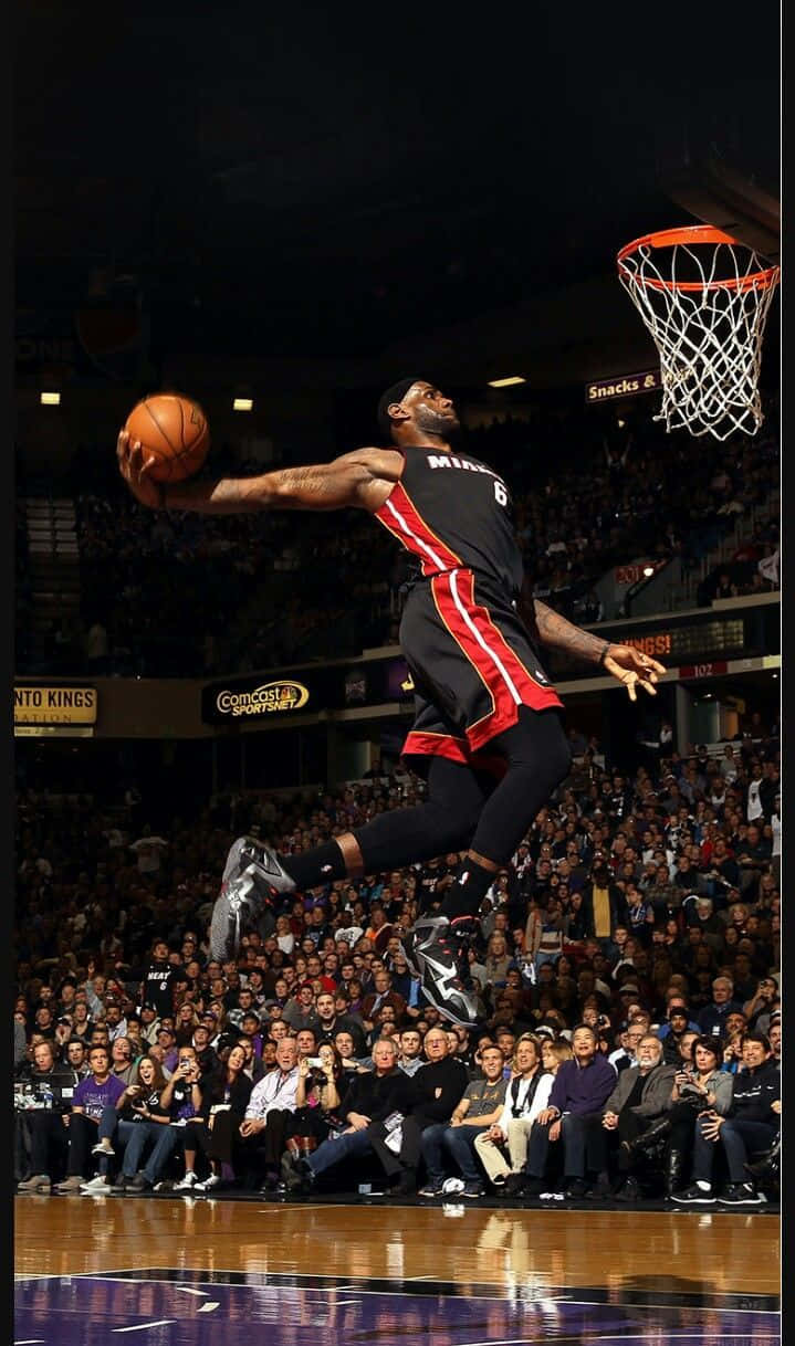 basketball player, black and red uniform, mid-dunk, SD Phone Wallpaper