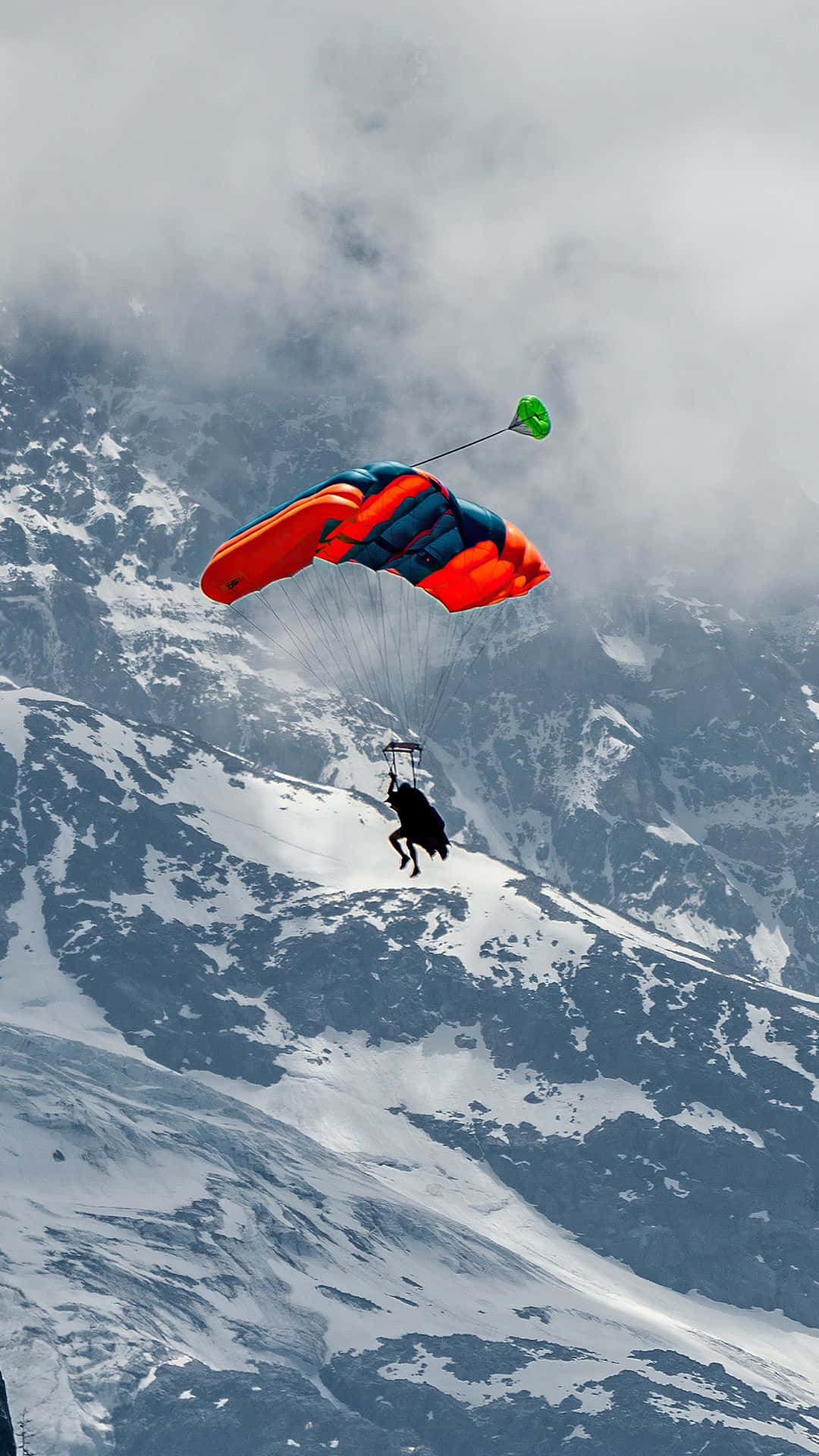 Skydiving Sports Phone, vibrant orange and blue canopy, snow-covered mountain range, Full HD Phone Wallpaper