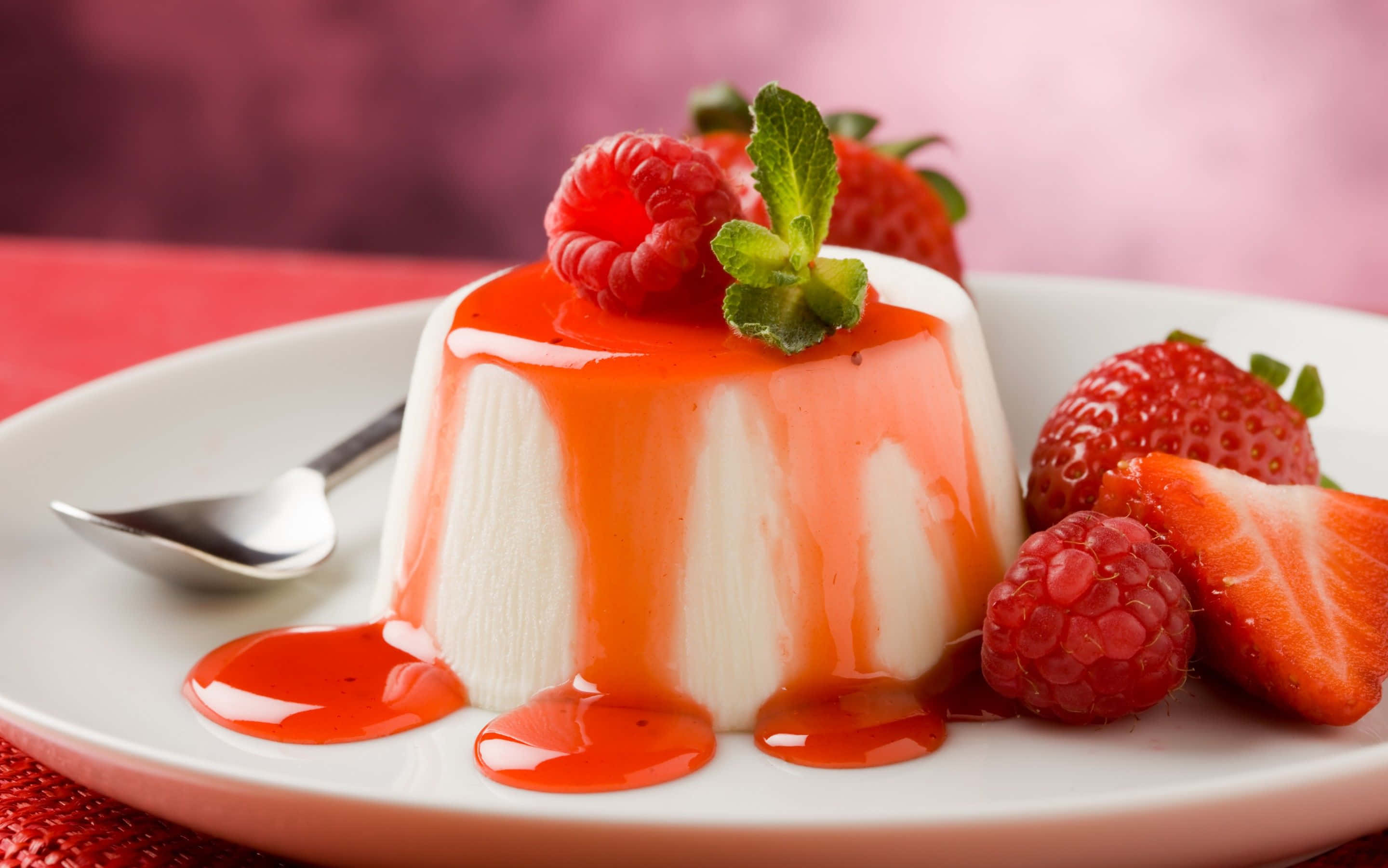 panna cotta, glossy red strawberry sauce, fresh berries, 2K Desktop Wallpaper