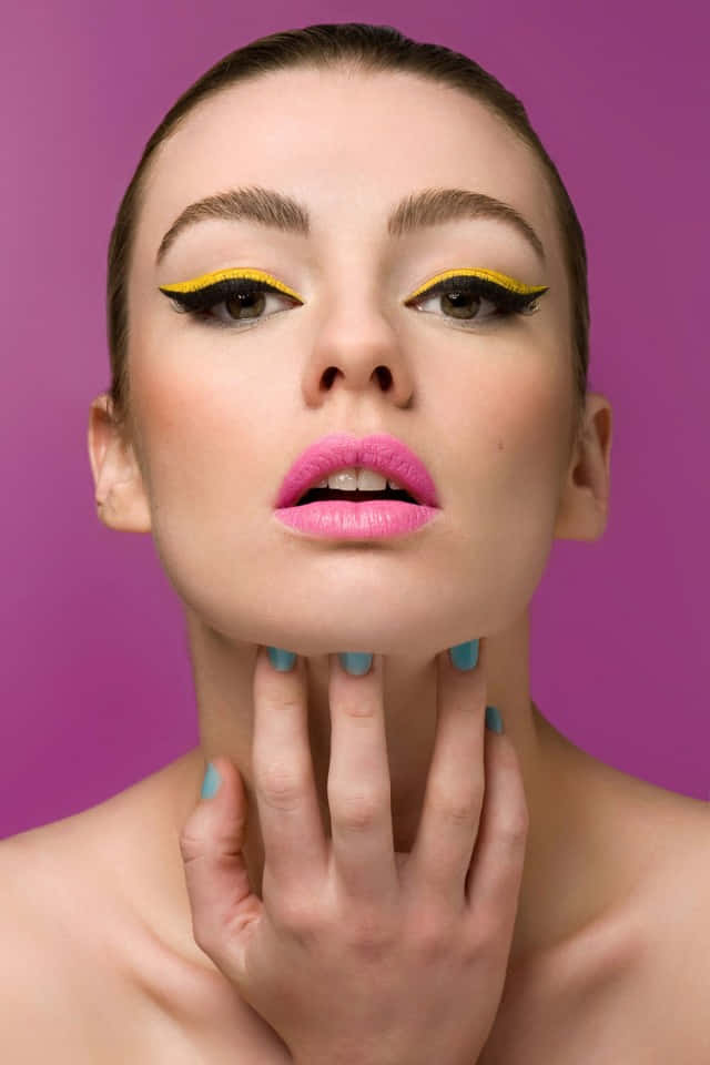 bold yellow winged eyeliner, pink lips, vivid purple background, SD Phone Wallpaper