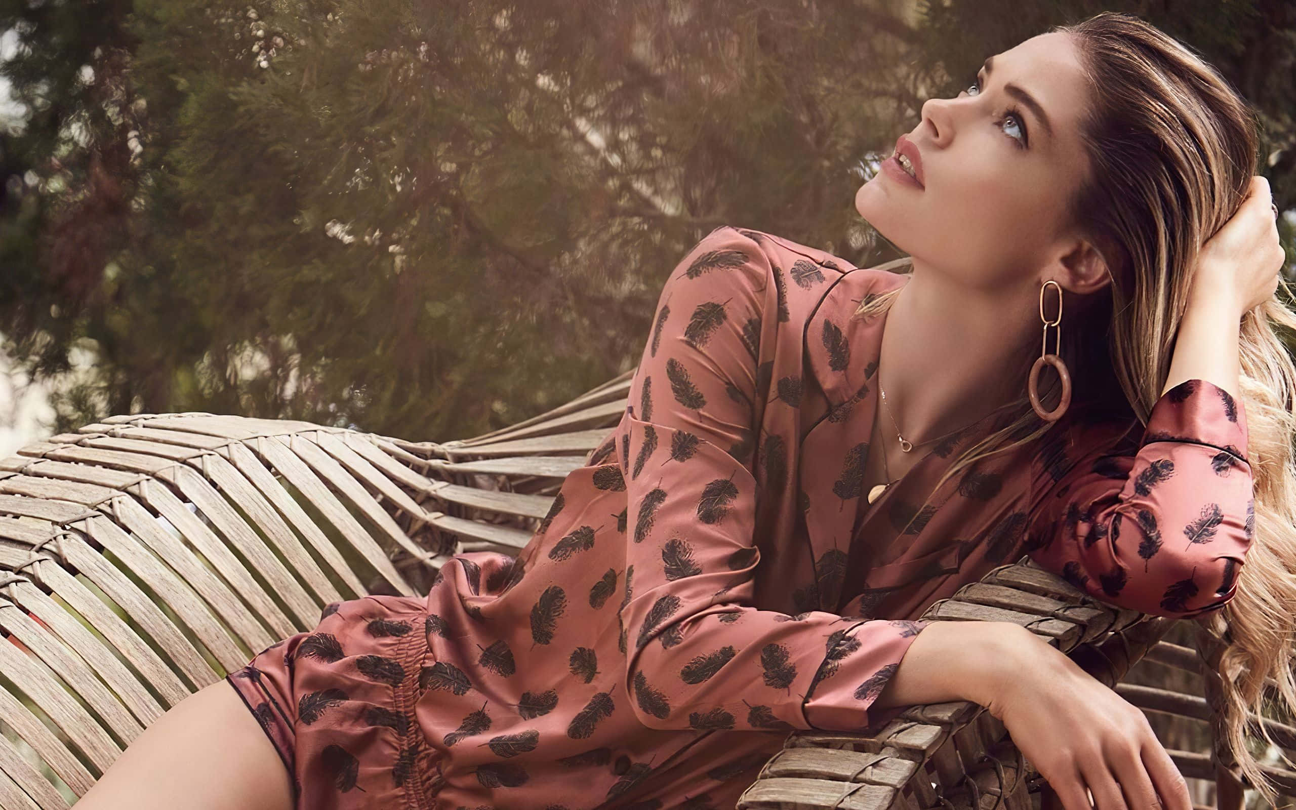 pink feather-print dress, woven bench, lush greenery, 2K Desktop Wallpaper